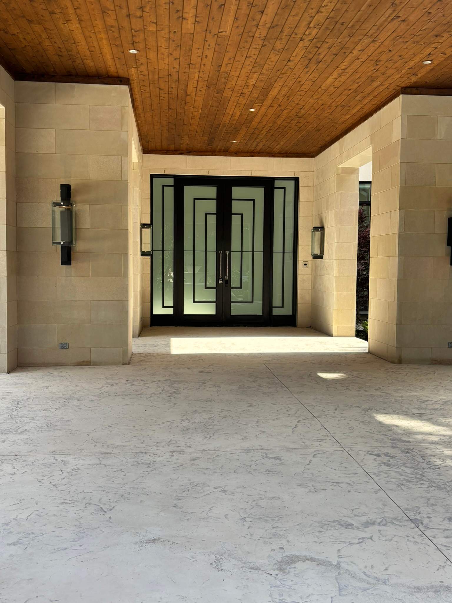 Modern Metal and Glass Entryway Installation with Custom Hardware Finishing in Dallas by Solara Custom Living