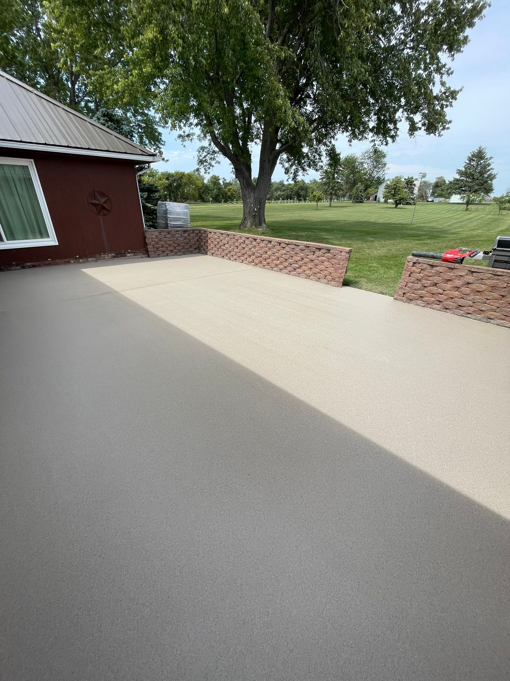 Concrete Patio Resurfacing and Protective Coating in Winfred, South Dakota by Select Painting, Coatings & Garage Cabinets