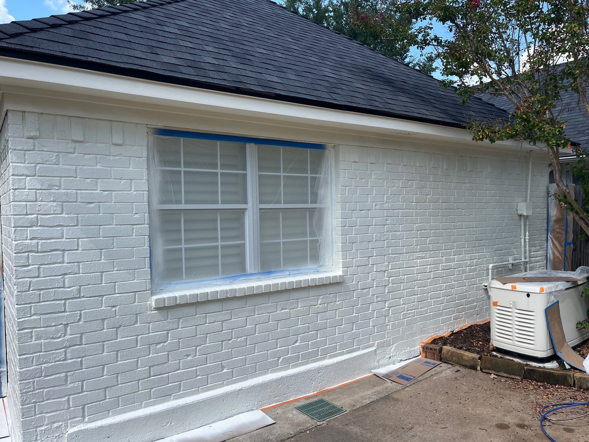 Exterior Painting in Tyler, TX | Brick House with White & Blue Finish by Quality Coats Painting