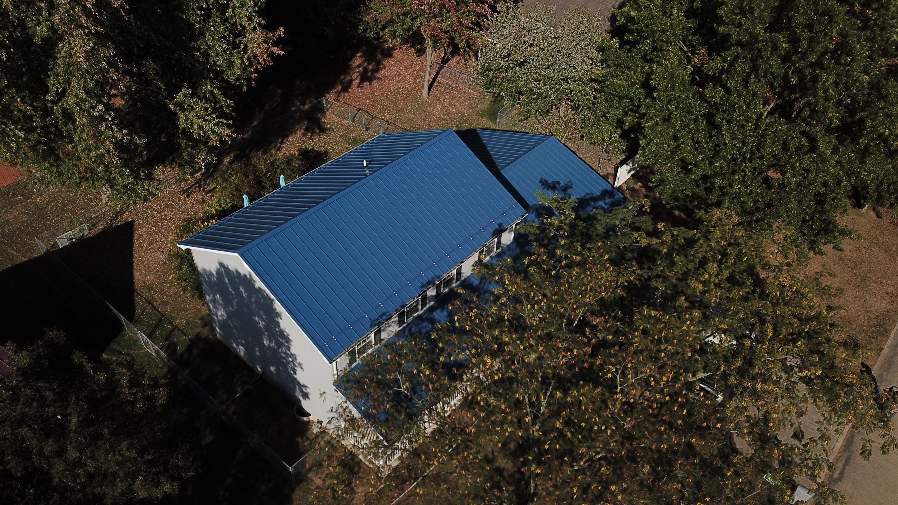 Residential Roofing Installation using Standing Seam Metal - Gallary Blue by RoofX 