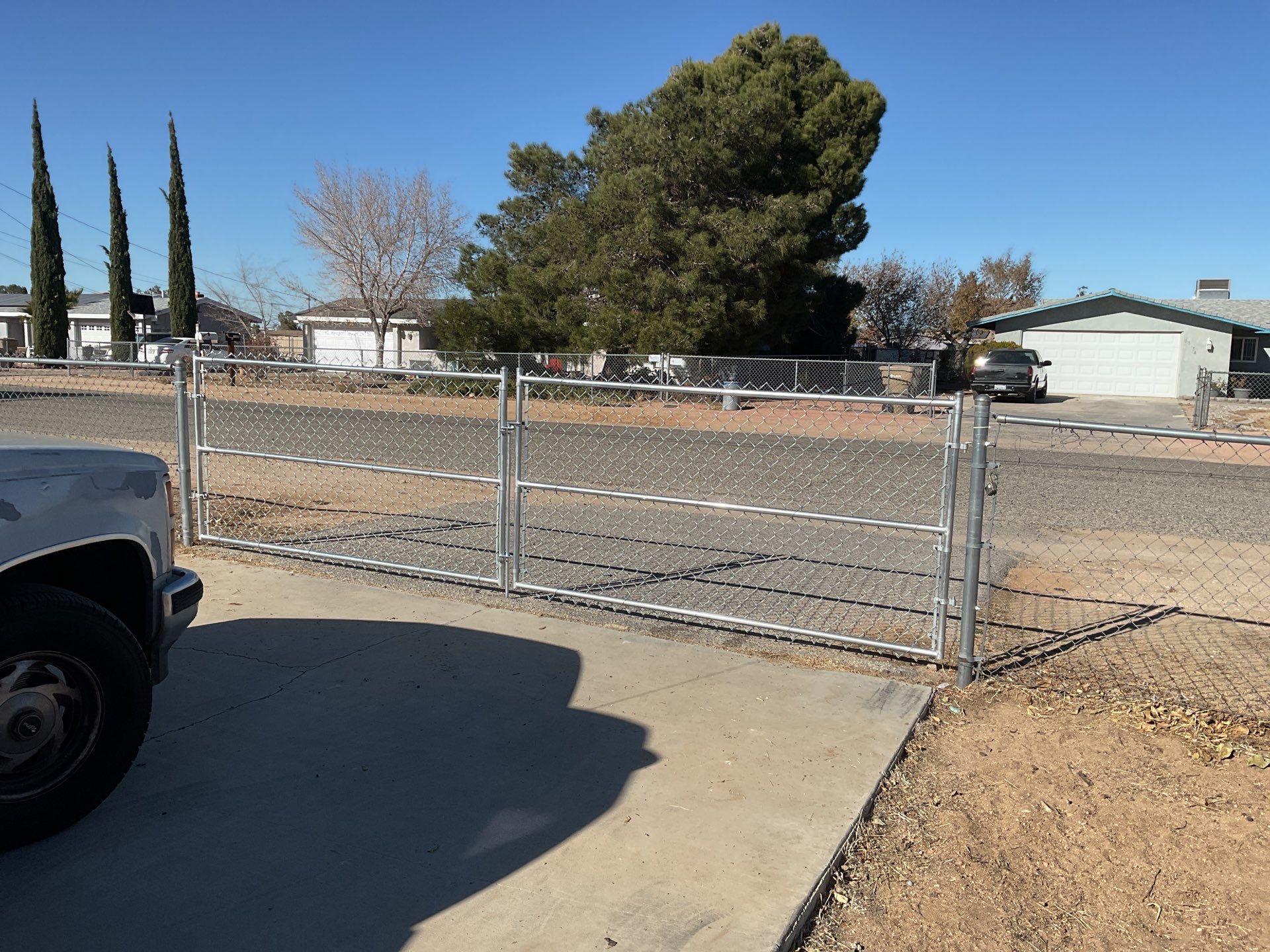 Fence Installation using vinyl and chain link  by Fence Guys Inc. 