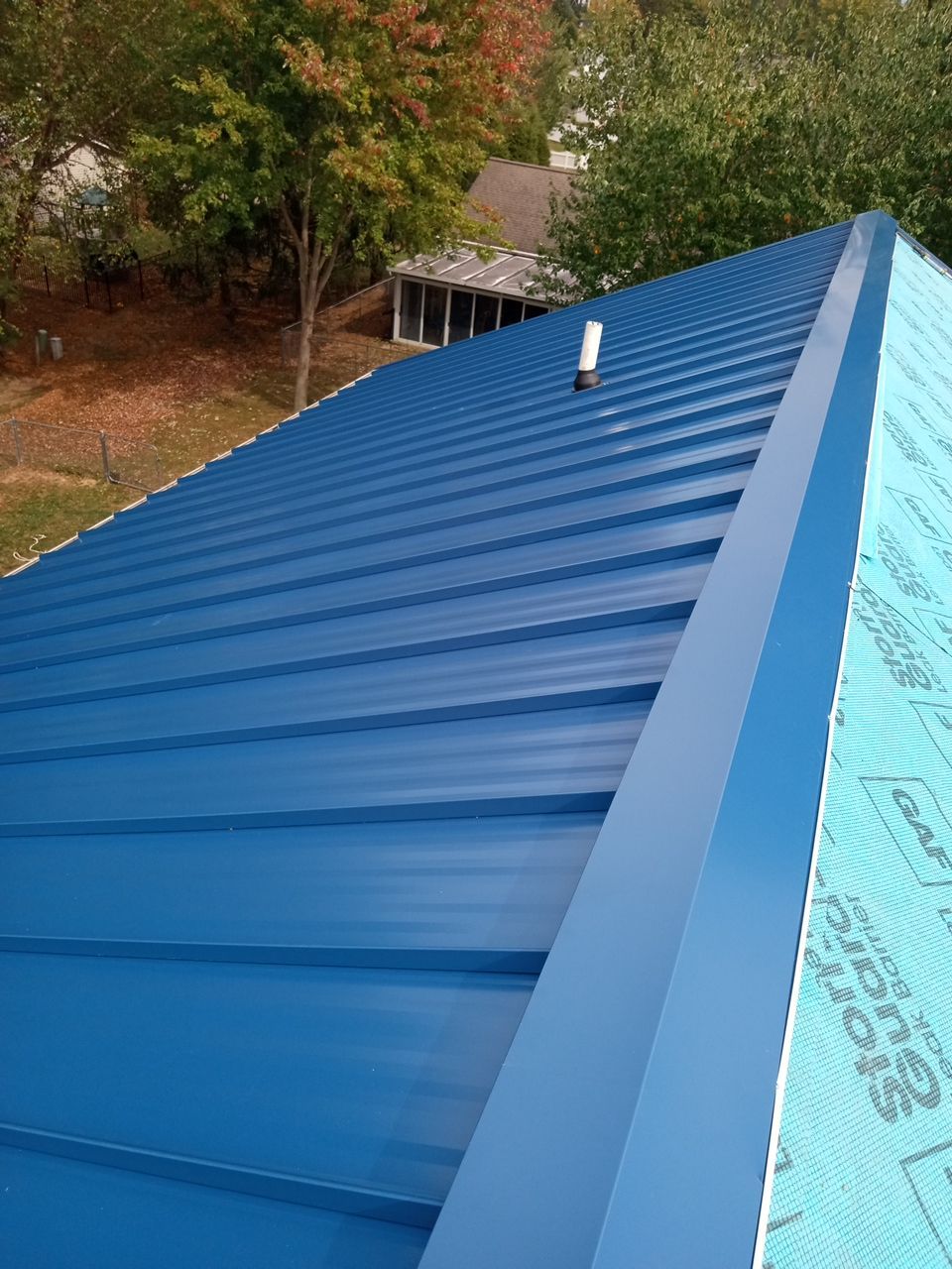 Residential Roofing Installation using Standing Seam Metal - Gallary Blue by RoofX 