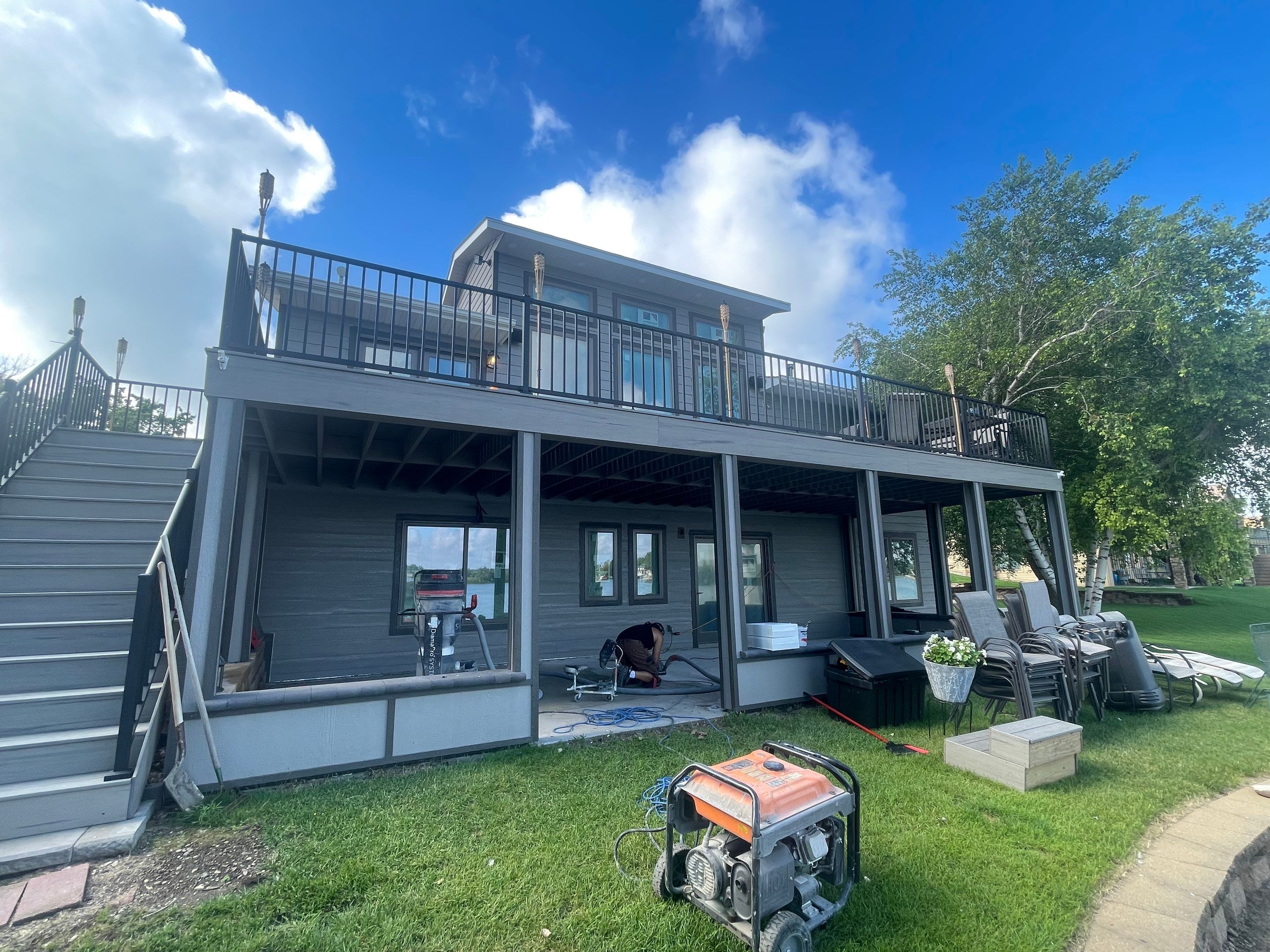 Lakefront Screened Patio Concrete Coating Installation in Wentworth by Select Painting, Coatings & Garage Cabinets