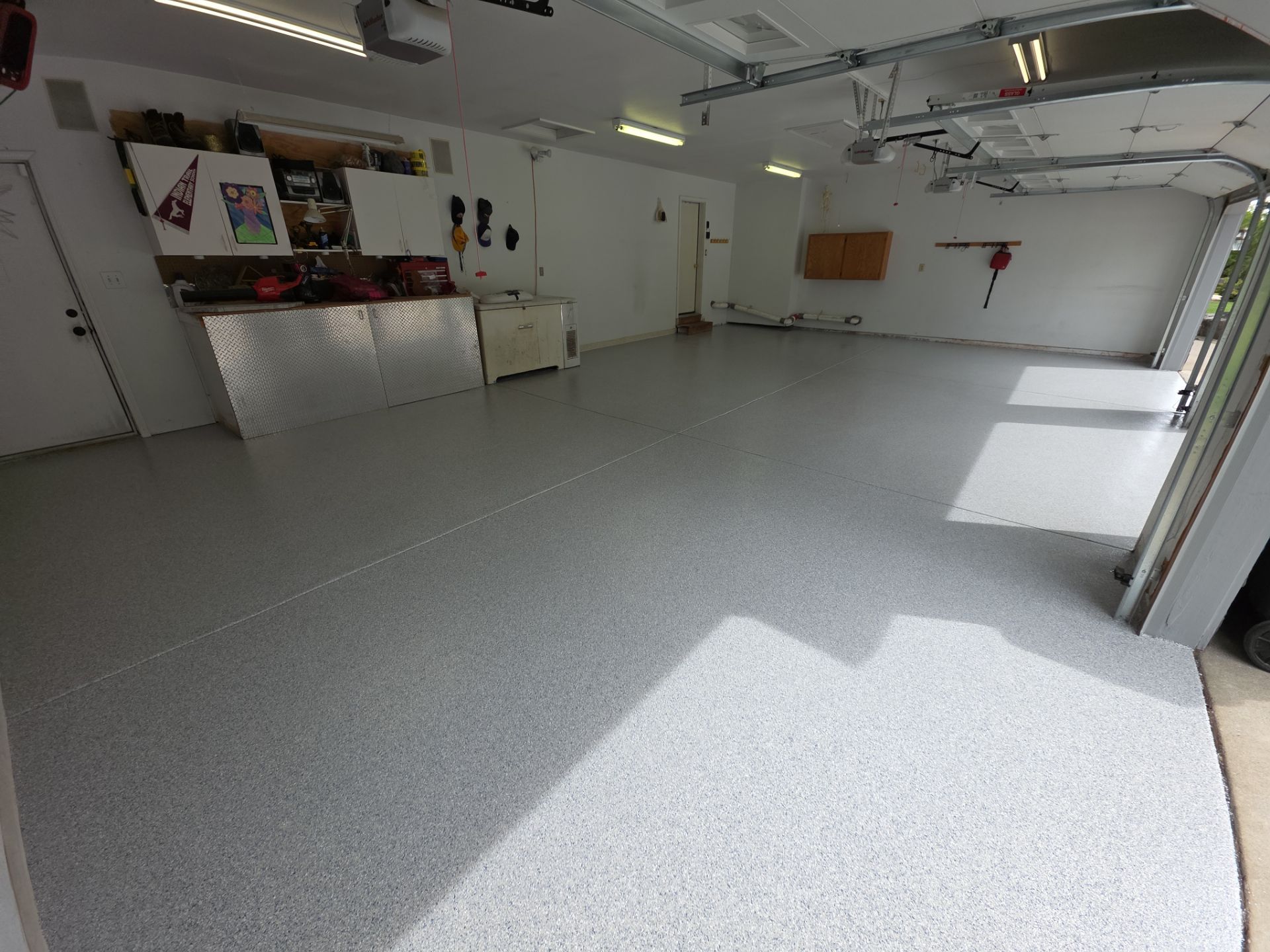 Garage Transformation using 1/8 Tidal Wave by Croc Coatings, LLC