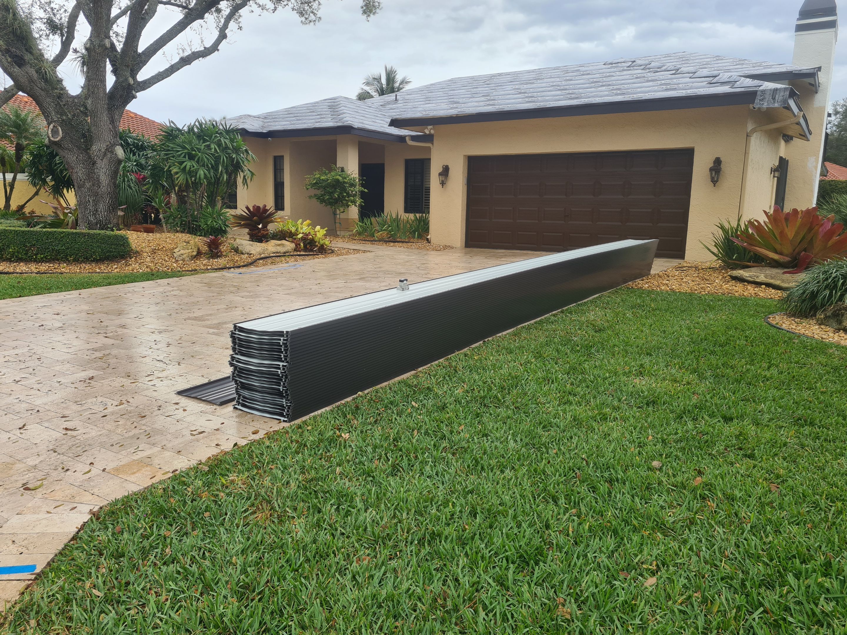 Residential Roofing Installation using 1" Nail strip metal roof by BLUES BROTHERS CONSTRUCTION CORP