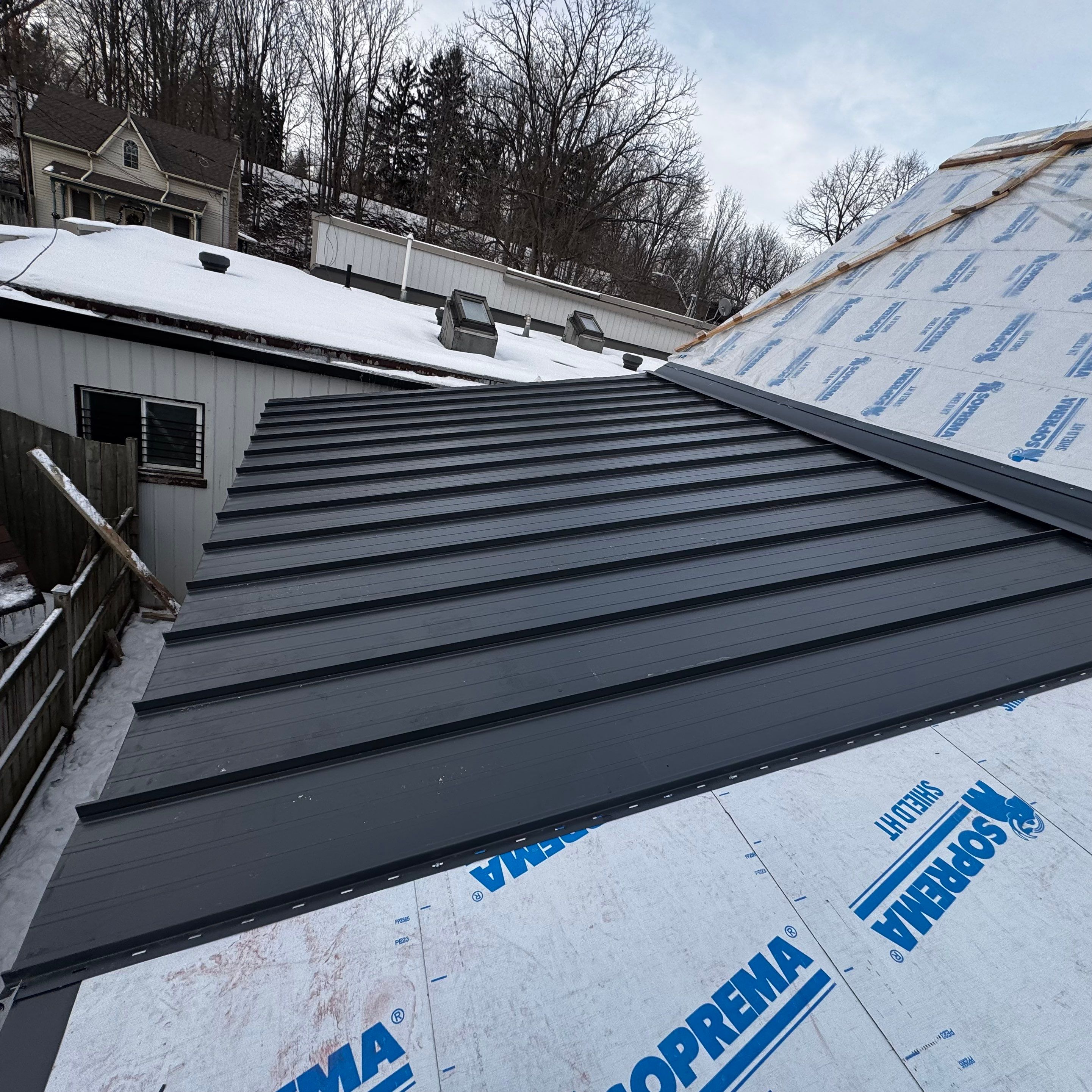 Commercial Roofing Installation using 16" Standing Seam Panels by Jay Carter Roofing & Sheet Metal