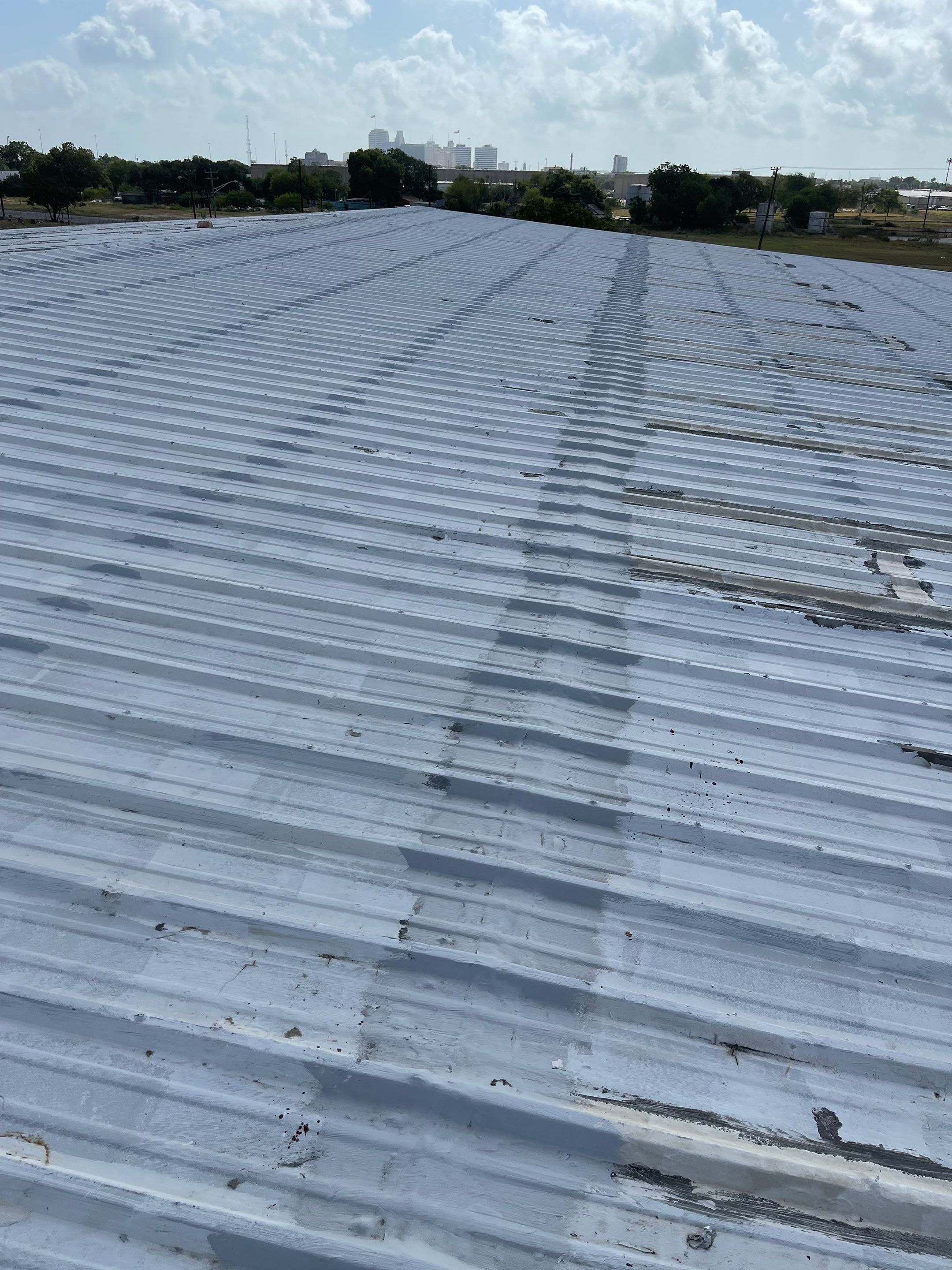 Commercial Roofing Installation using GAF 10 Year Acrylic System by Lighthouse Roofing