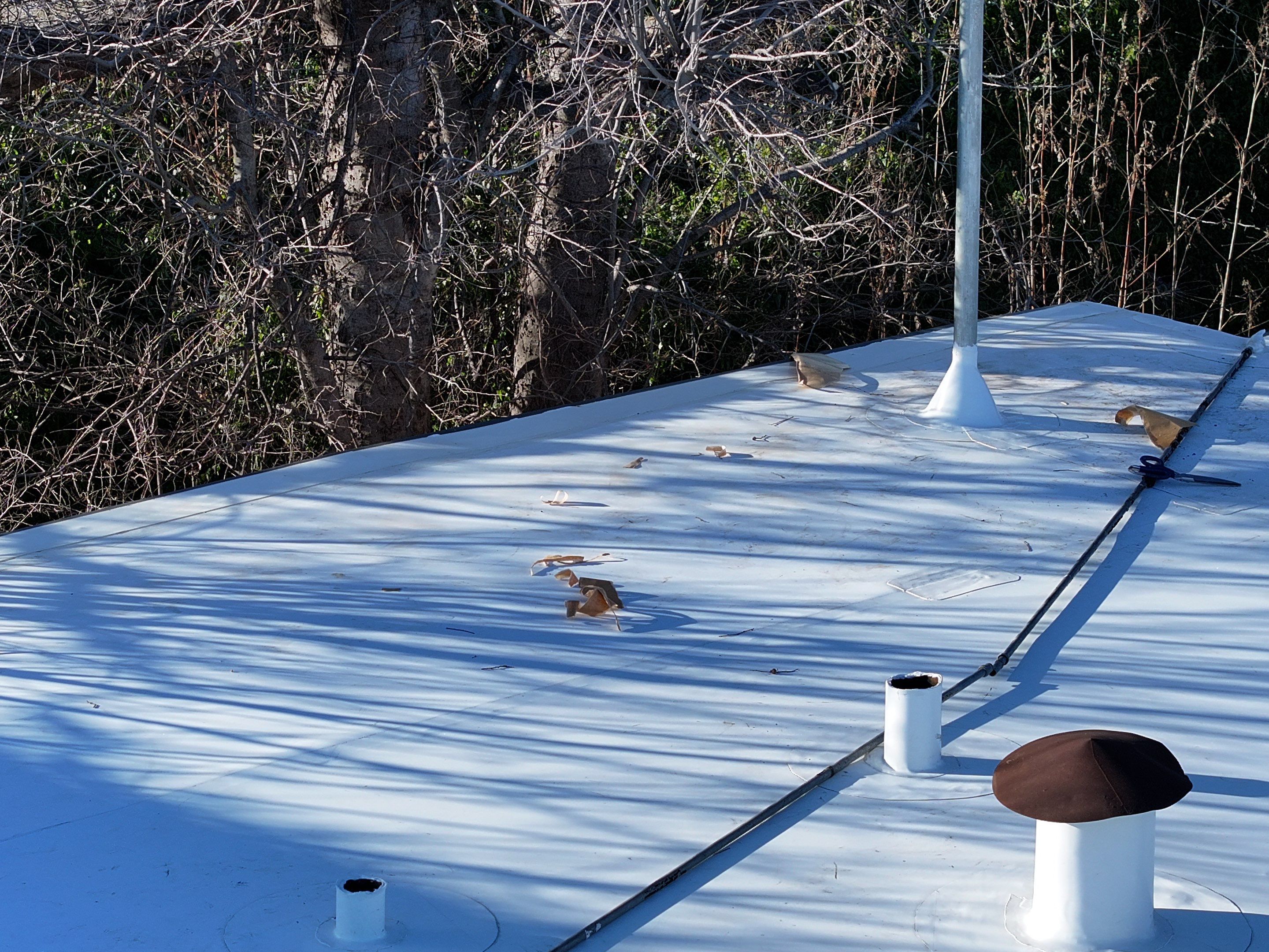 Commercial roofing overlay using GAF TPO over an old ballast roof by Becker Roofing and Exteriors