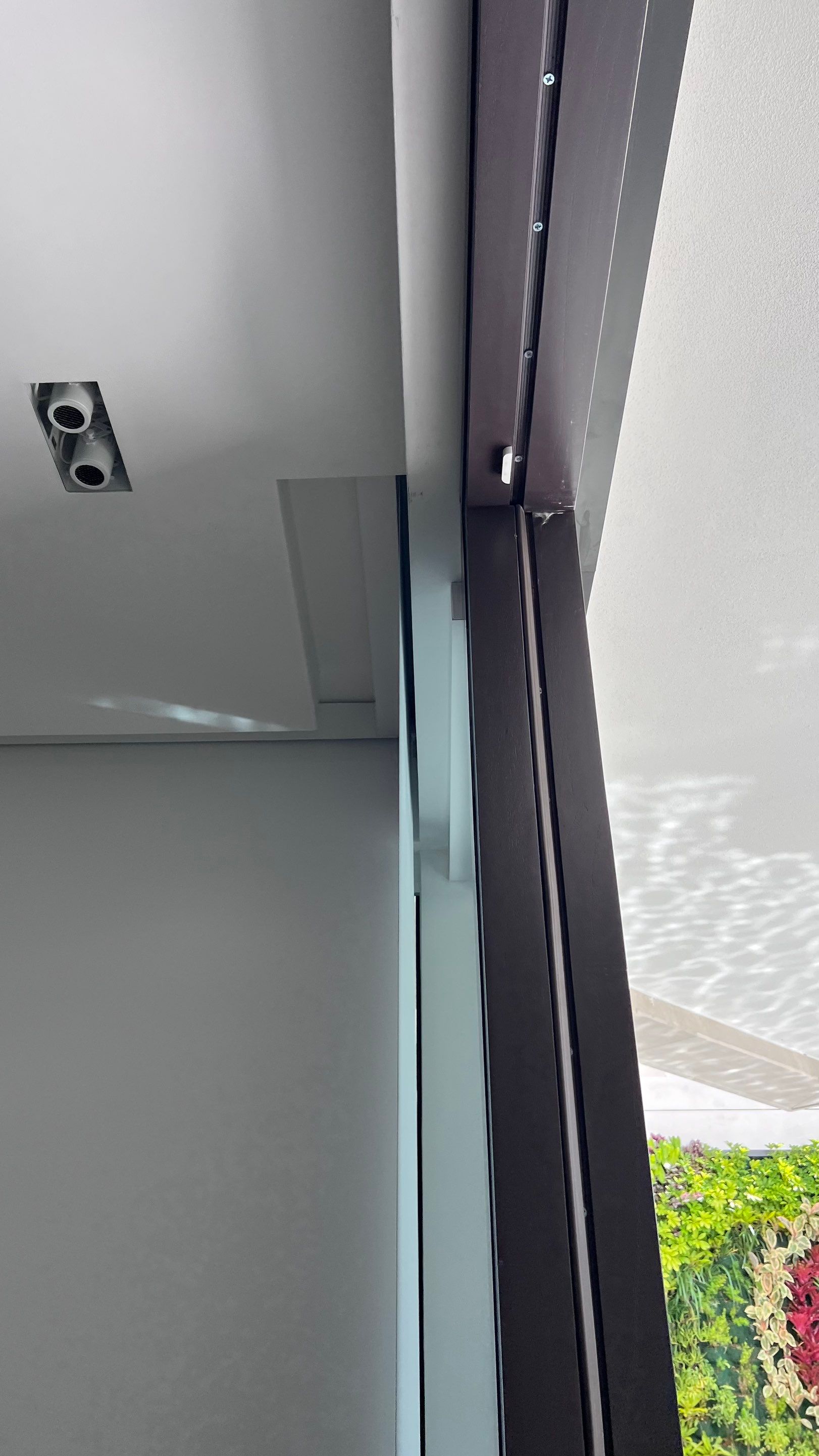 Custom Material Pivot Door installation by Impact Precious Wood Inc.