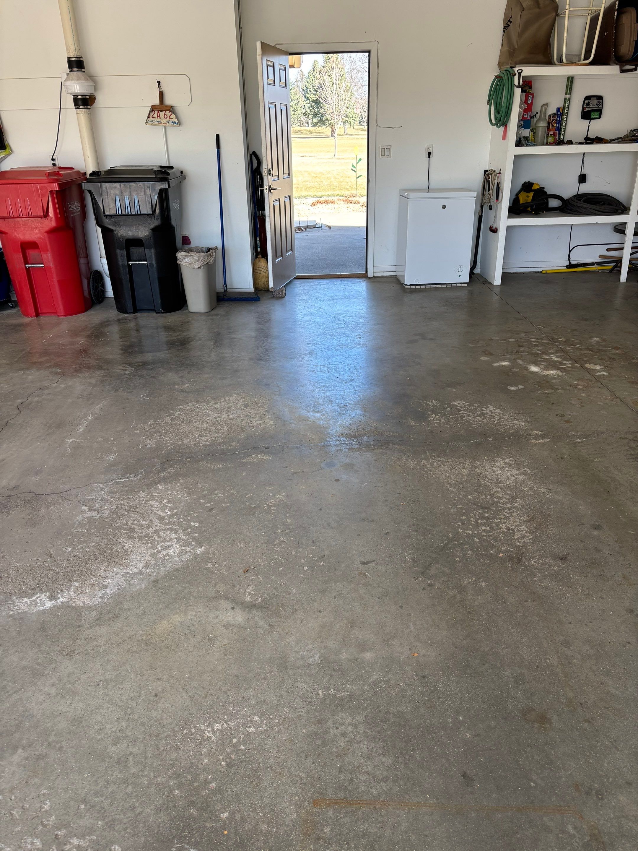 Yankton Garage Floor Restoration with Gray Speckled Epoxy Coating by Select Painting, Coatings & Garage Cabinets