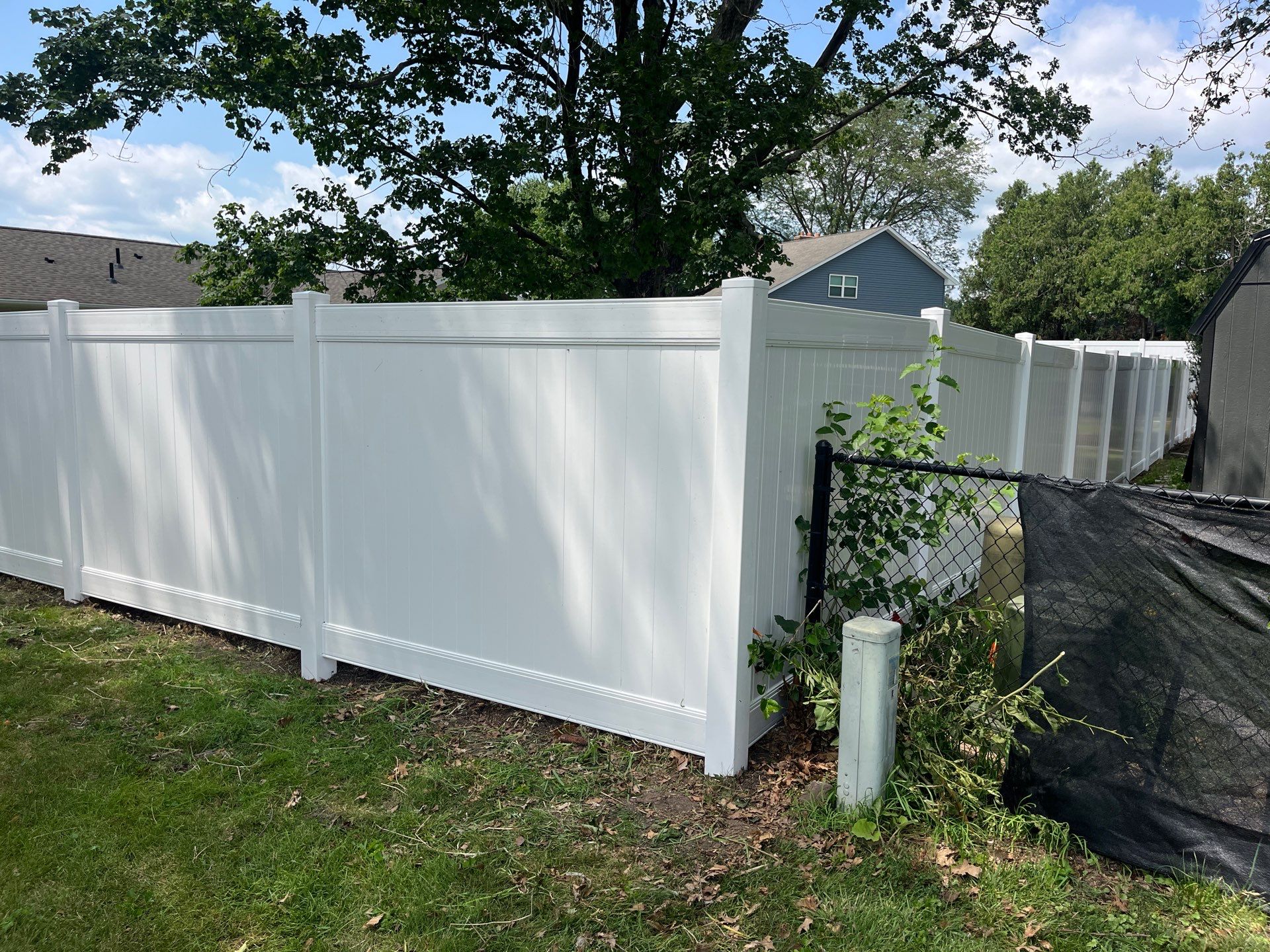 White Vinyl Privacy Fence Installation in Cedar Falls by Perfect Picket Fence and Stain