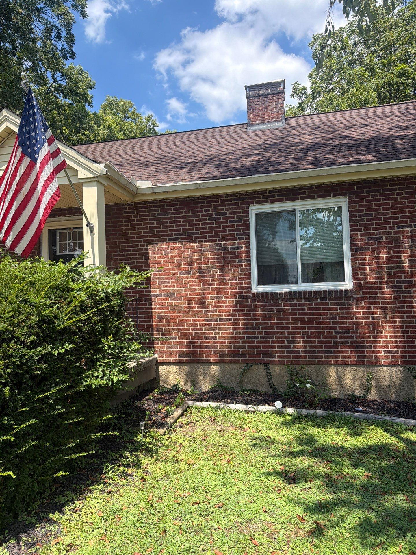 Seamless Black Gutter Installation for Cincinnati Brick Ranch Home by Agc Cincy