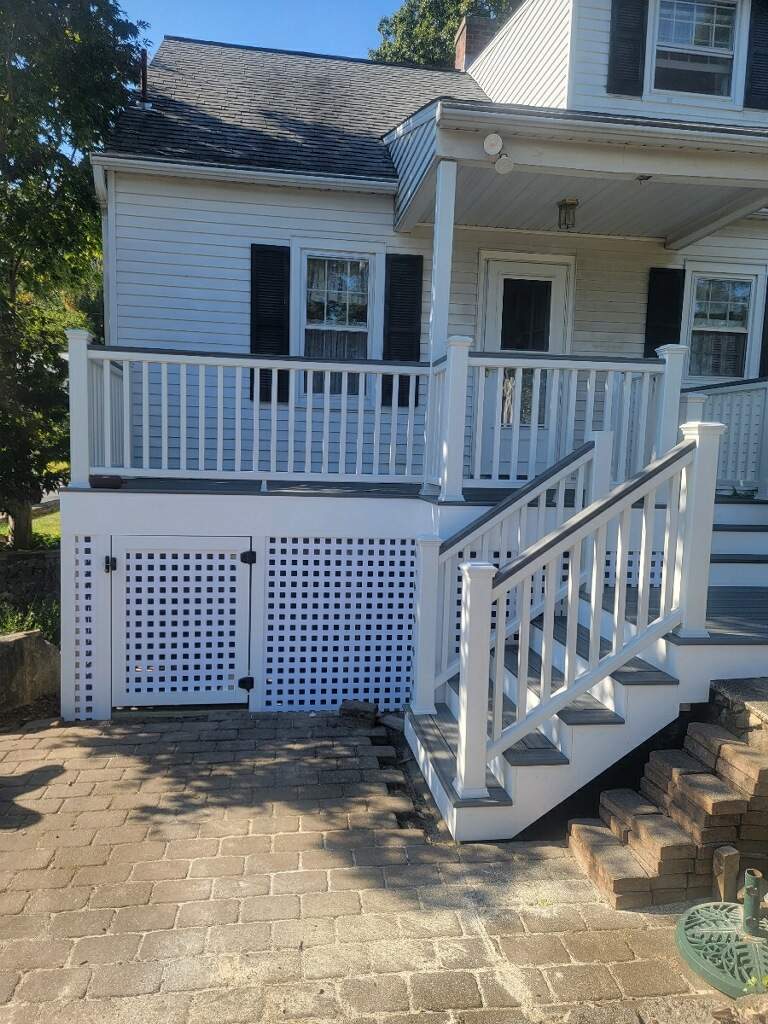 Front deck replacement, Trex tropical Island mist boards and matching cocktail rail, Lattice bottom with access door by DiGiorgi Roofing and Siding Inc