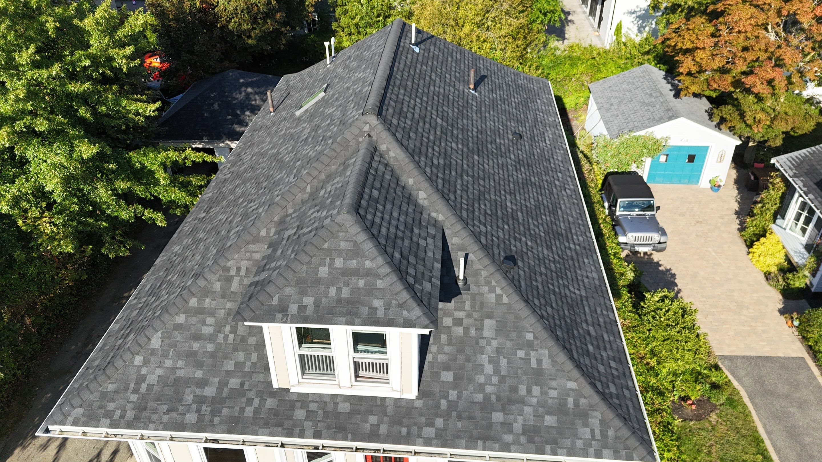 Roof Replacement with Skylight Flashing in Waltham, MA by Mighty Dog Roofing of Greater Middlesex County
