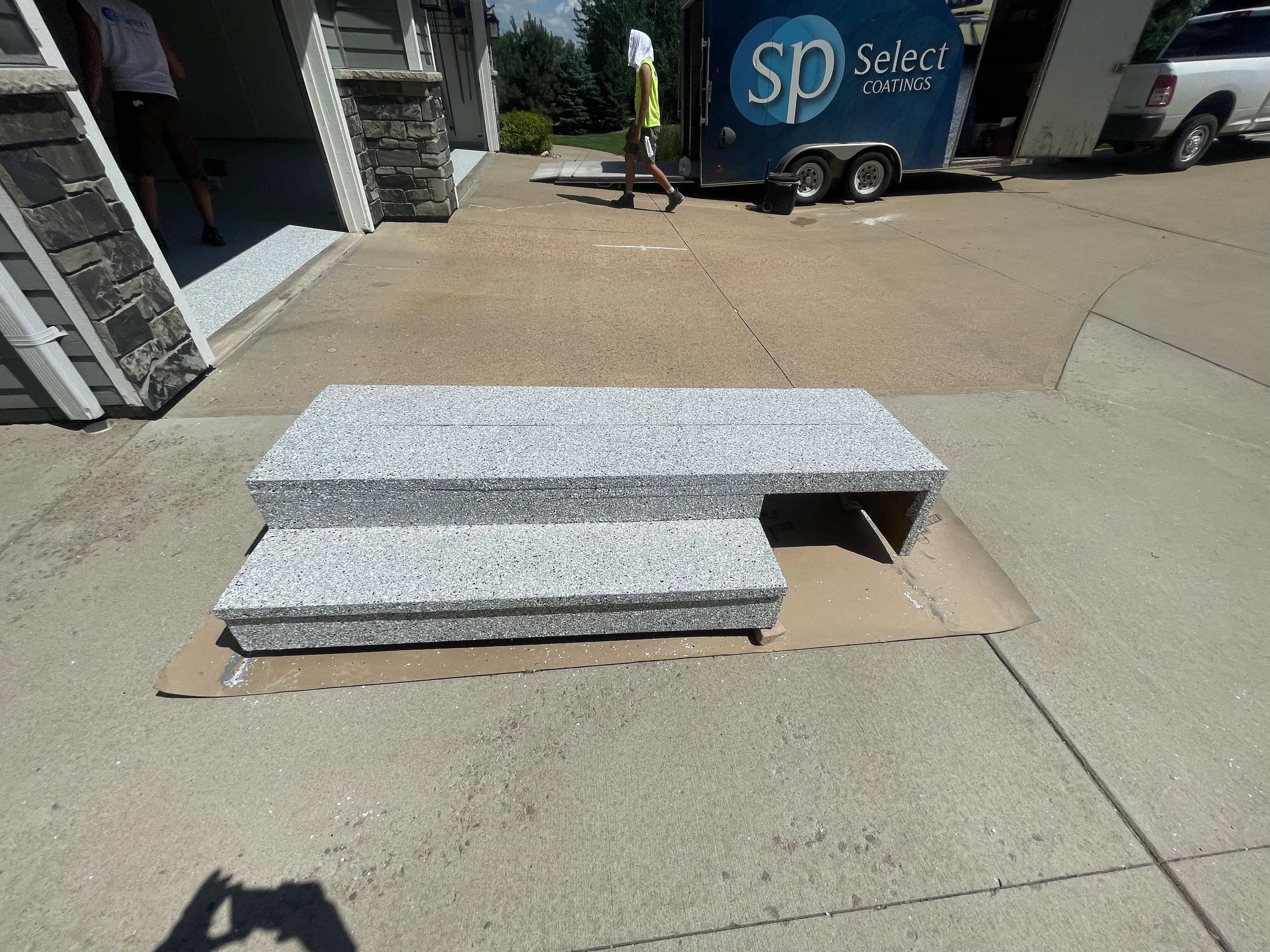 Feather Grey Garage Floor Coating Installation in Sioux Falls by Select Painting, Coatings & Garage Cabinets