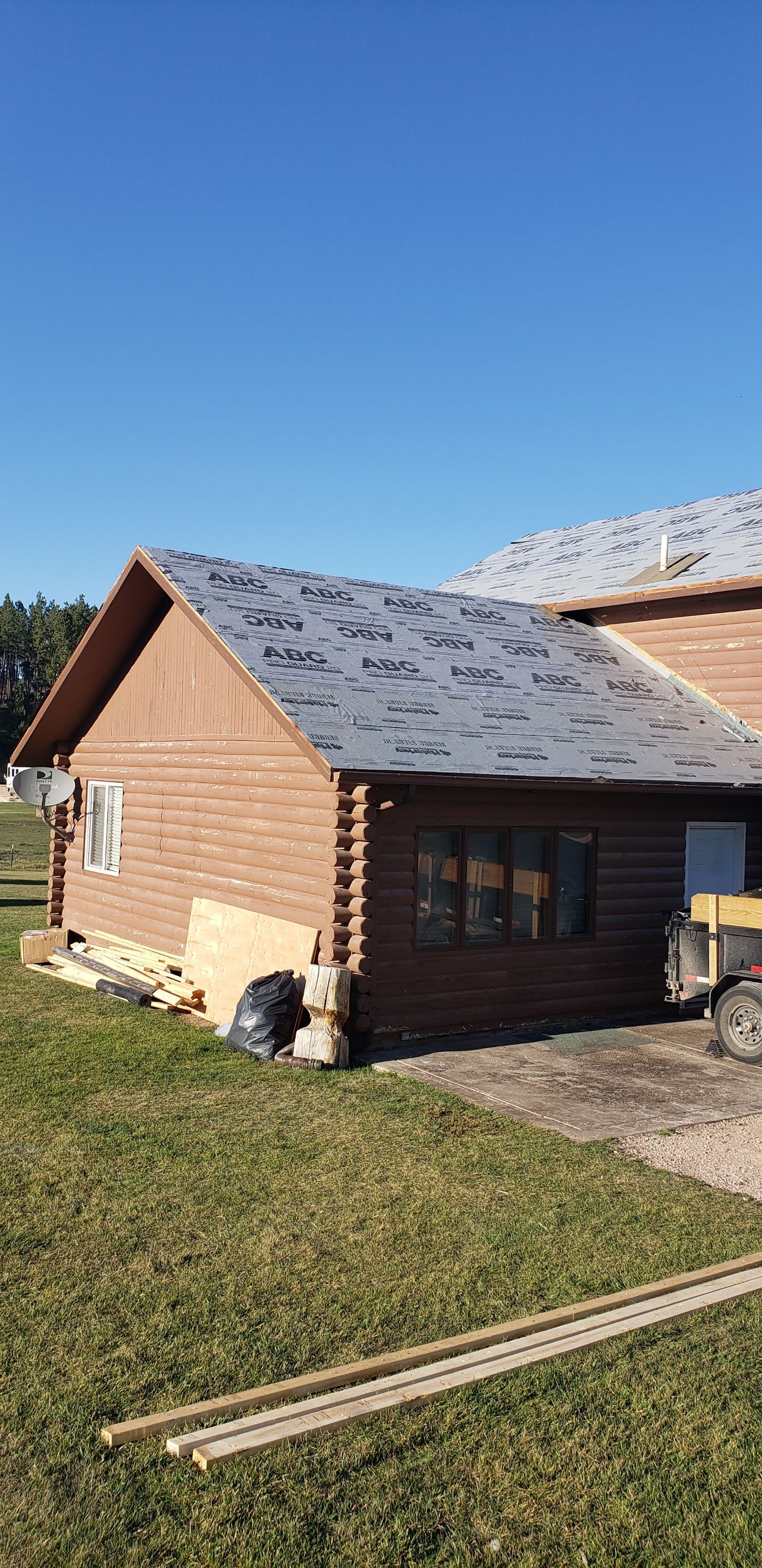Hill Country Guest Ranch using Steel Roofing, Gutters, Log Cabin Staining by Lightning Exteriors