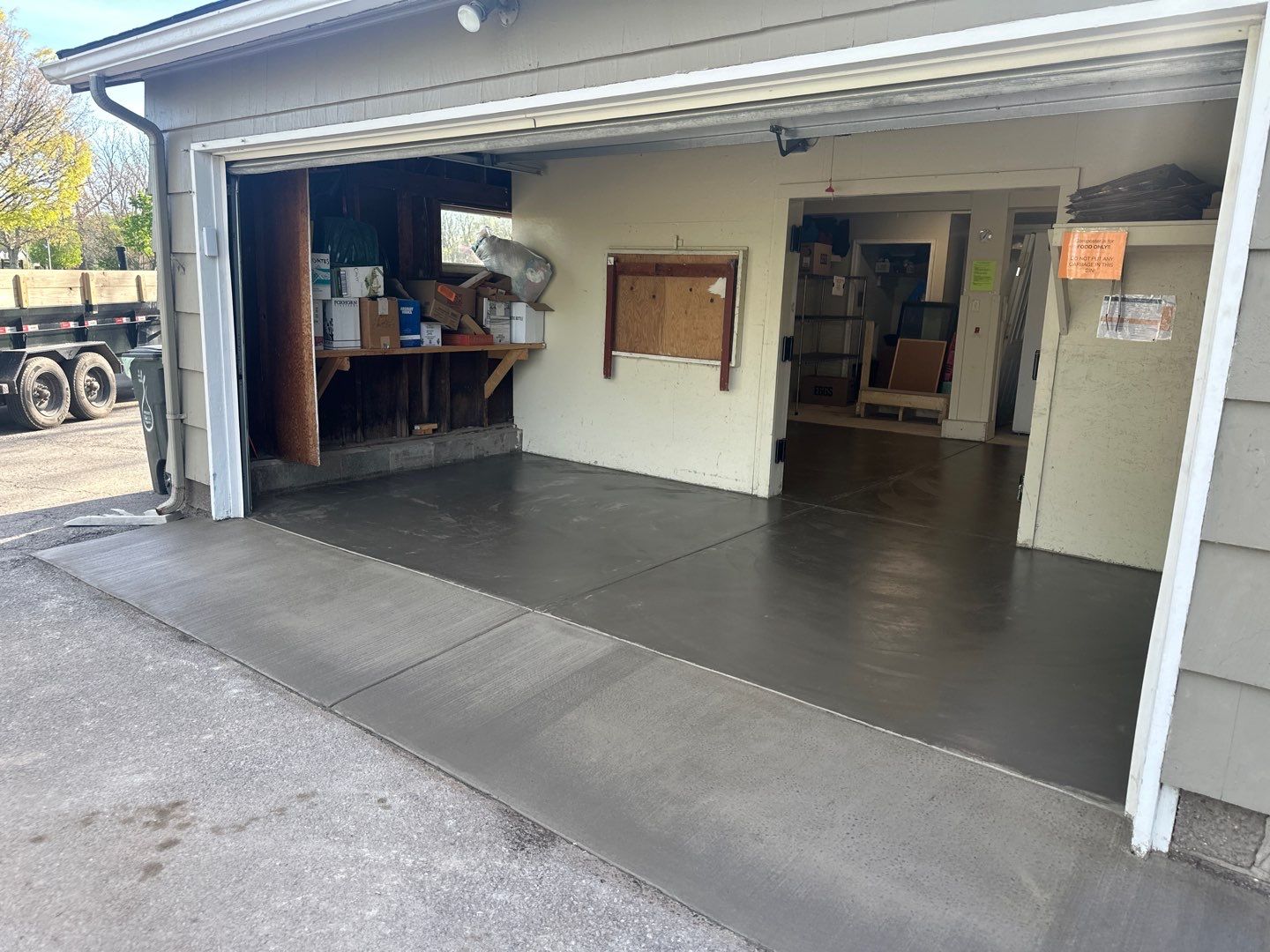 Concrete garage floor replacement with a broom finished apron  by NG Masonry & Construction LLC