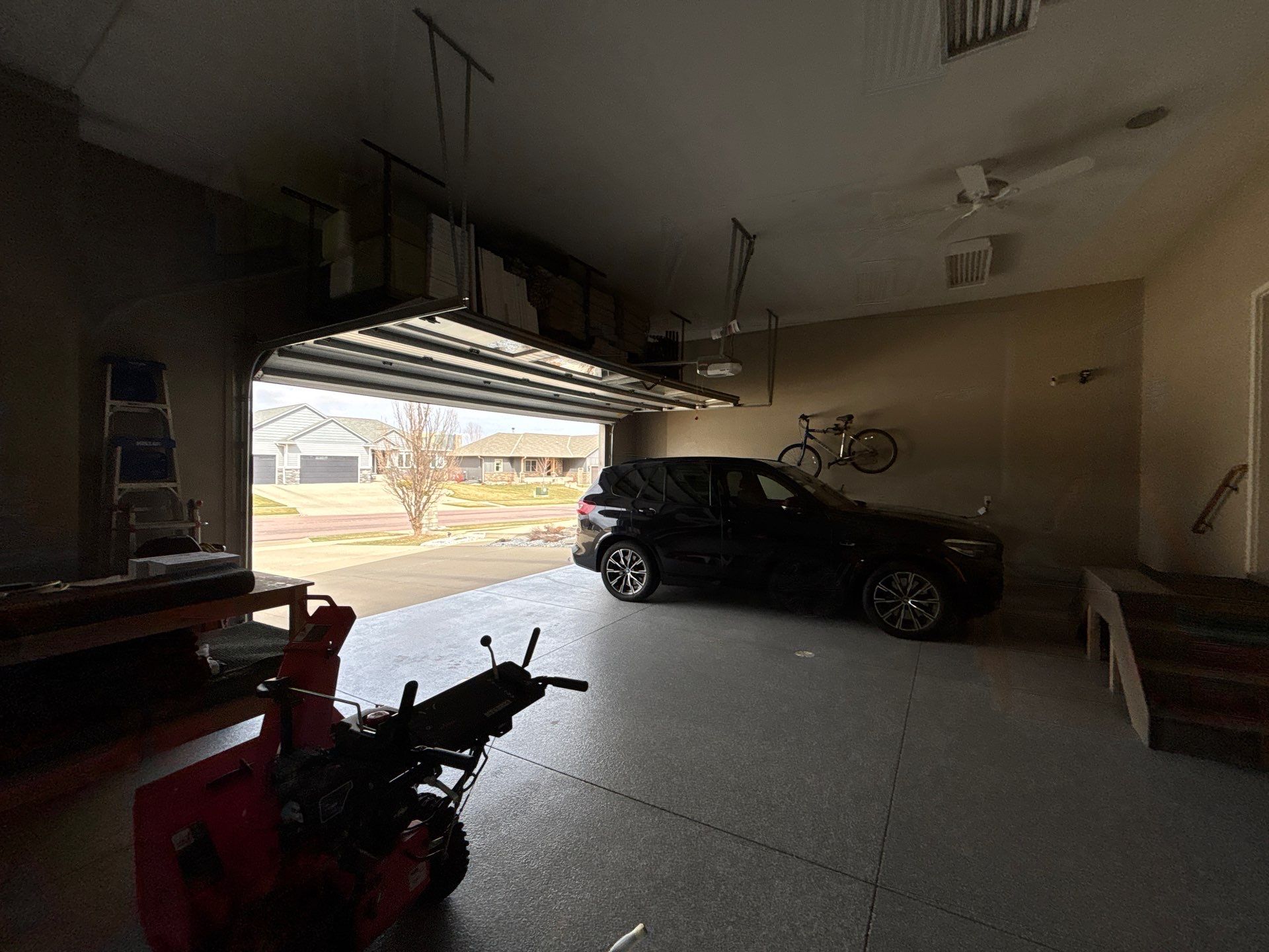 Speckled Grey Epoxy Garage Floor Coating Installation in Tea by Select Painting, Coatings & Garage Cabinets