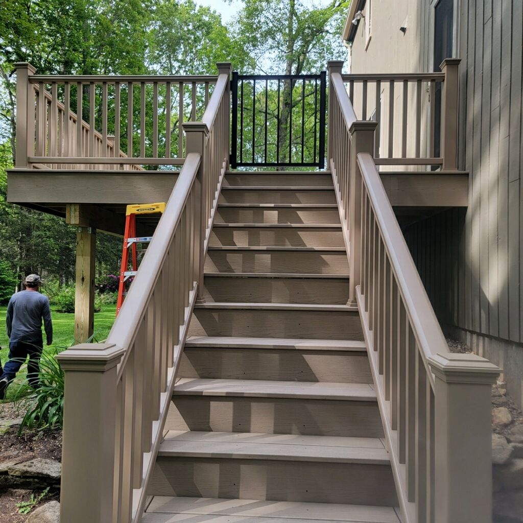 Deck Replacement using Trex Transcend Rope Swing and matching Transcend railings and trex fascia by DiGiorgi Roofing and Siding Inc