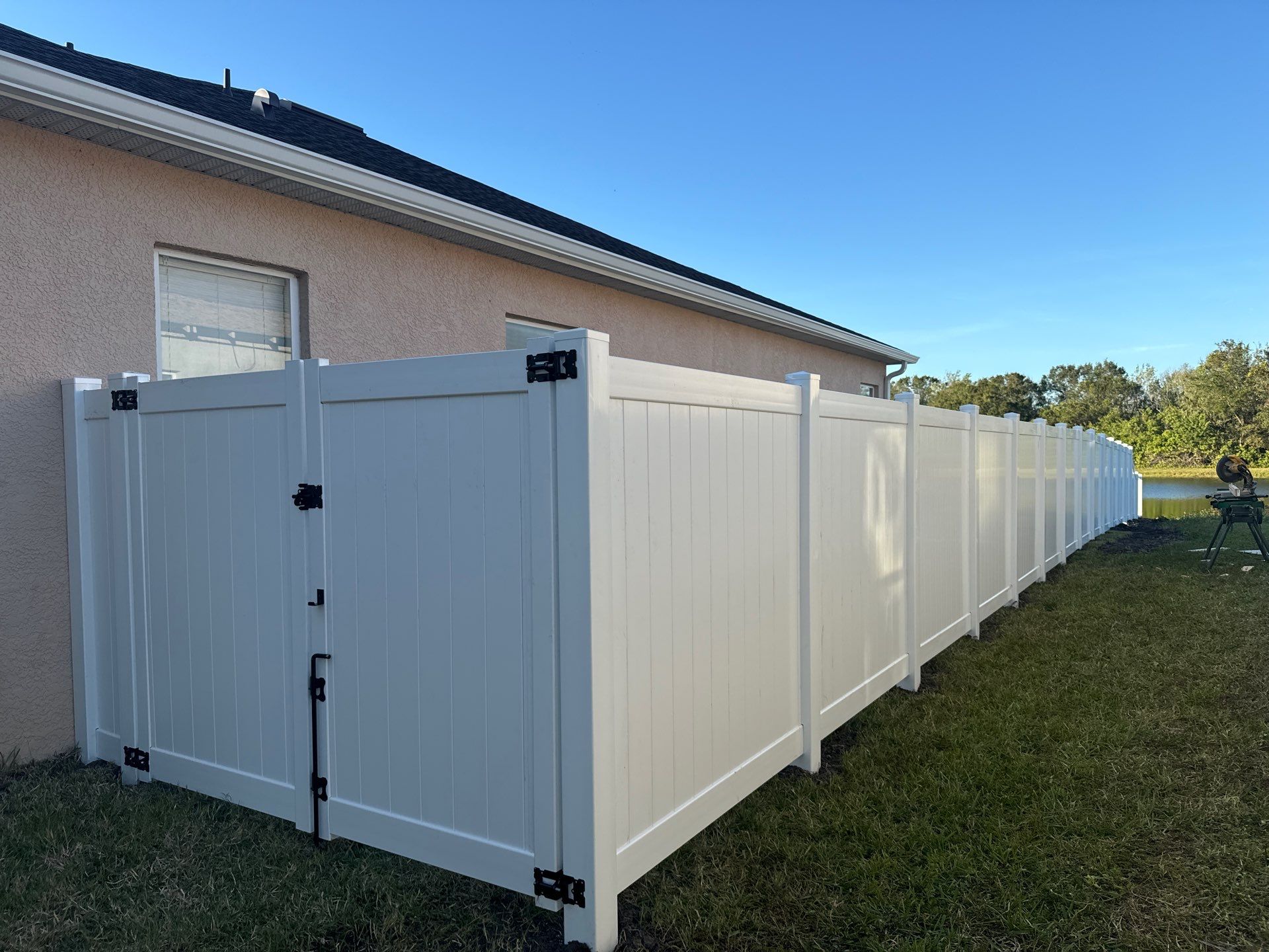 Vinyl Picket Fence Installation using 6Ft White Vinyl Privacy Fence with a 4Ft White Clearwater Picket Fence by Asap fence and gates, LLC