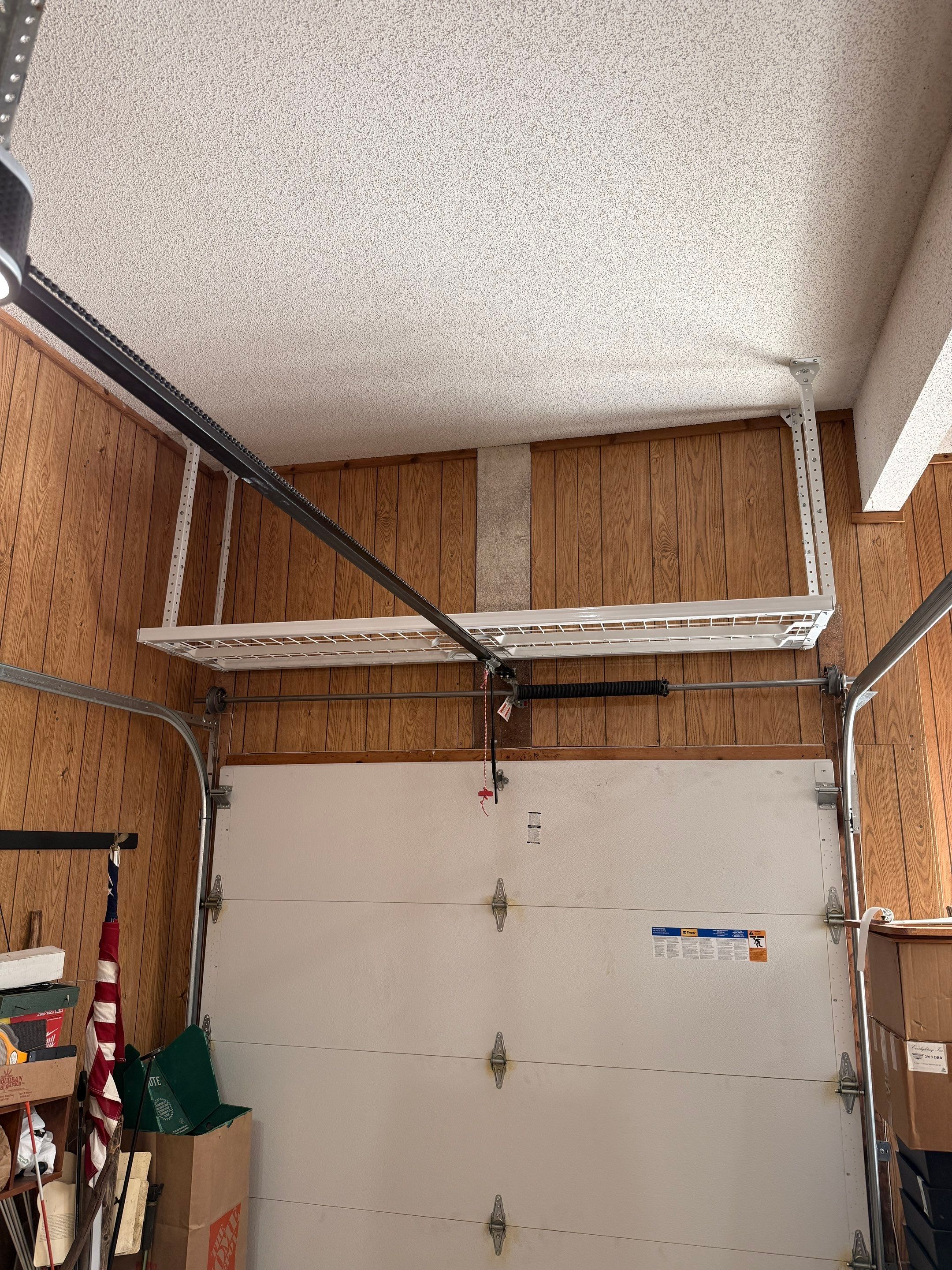 Garage Organization With Overhead Racks and Slatwall in Overland Park by Banner Garage