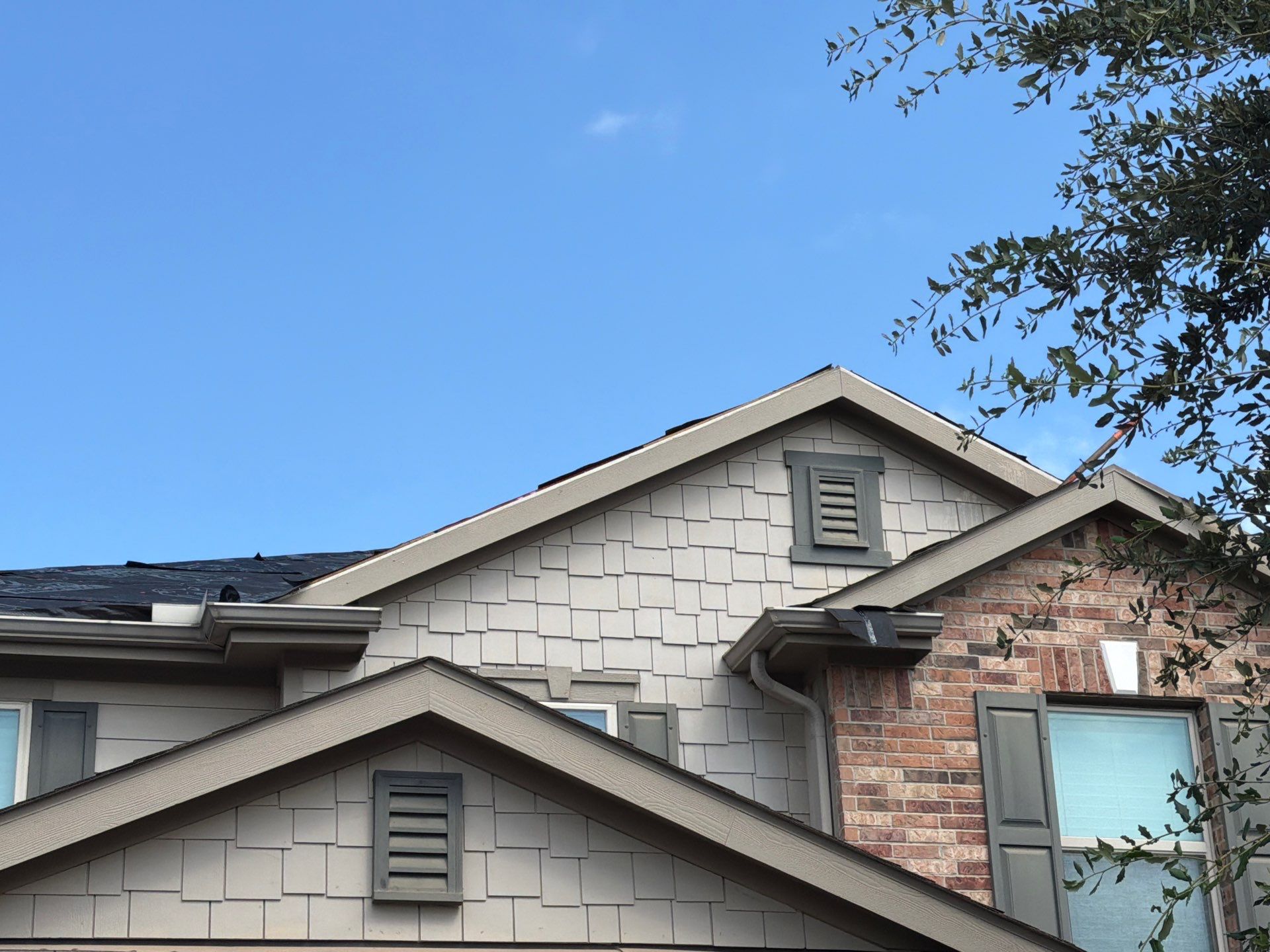 Owens Corning Shingle Roofing Replacement for Houston Two-Story Home by Houston Roofing & Construction