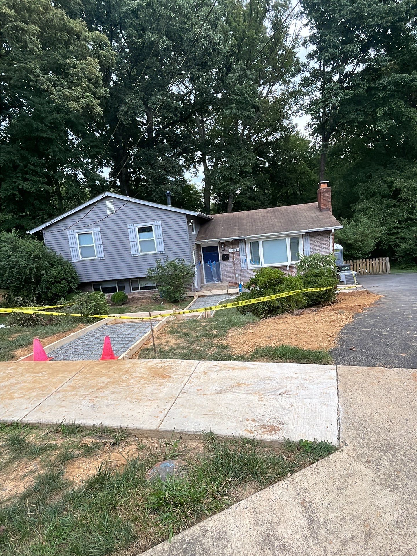 New walkway with stairs and a new front porch by Fairfax Contractors, LLC