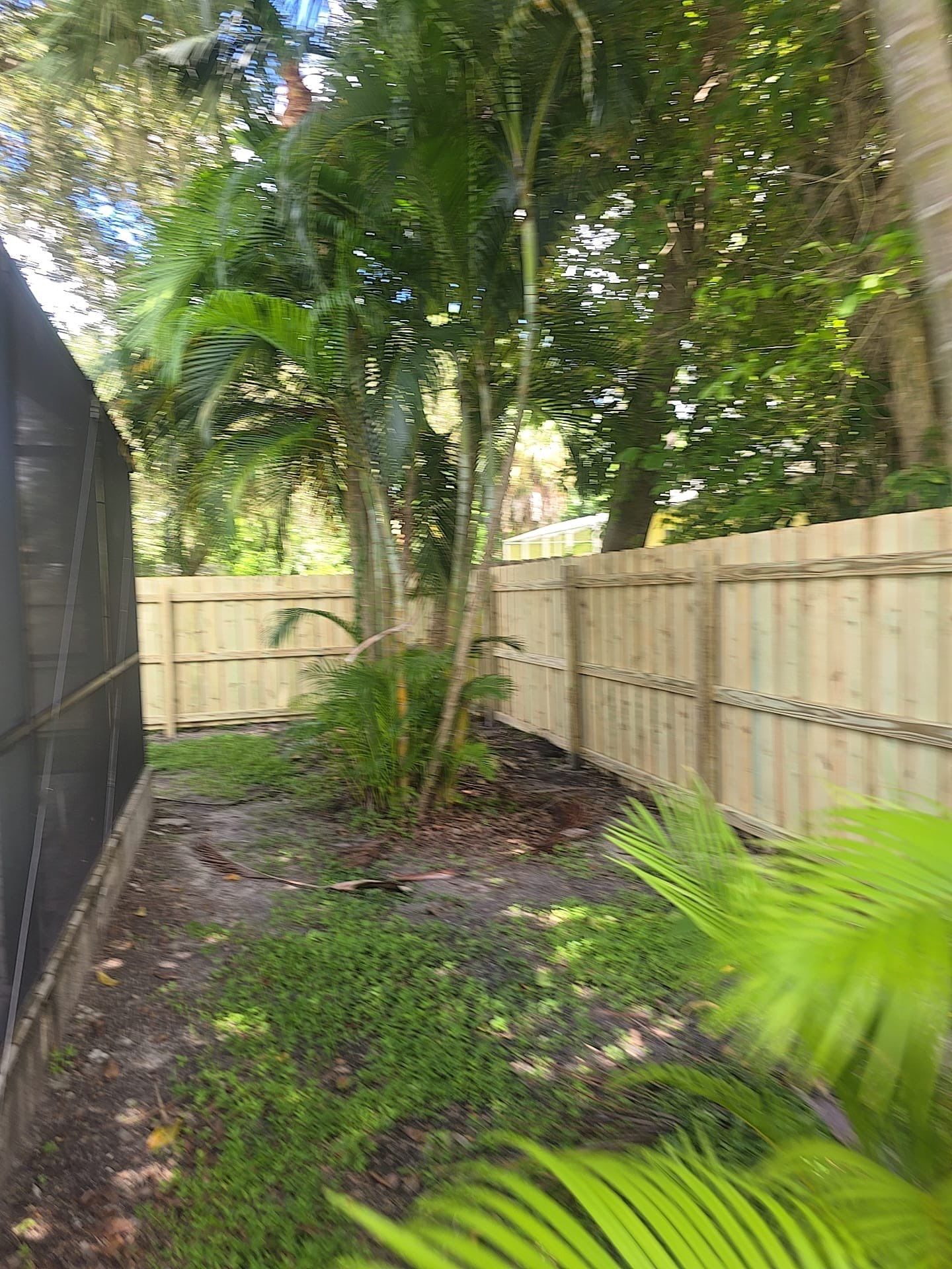 Wood Privacy Fence Installation with Double Gate in Port Charlotte by True Fence LLC