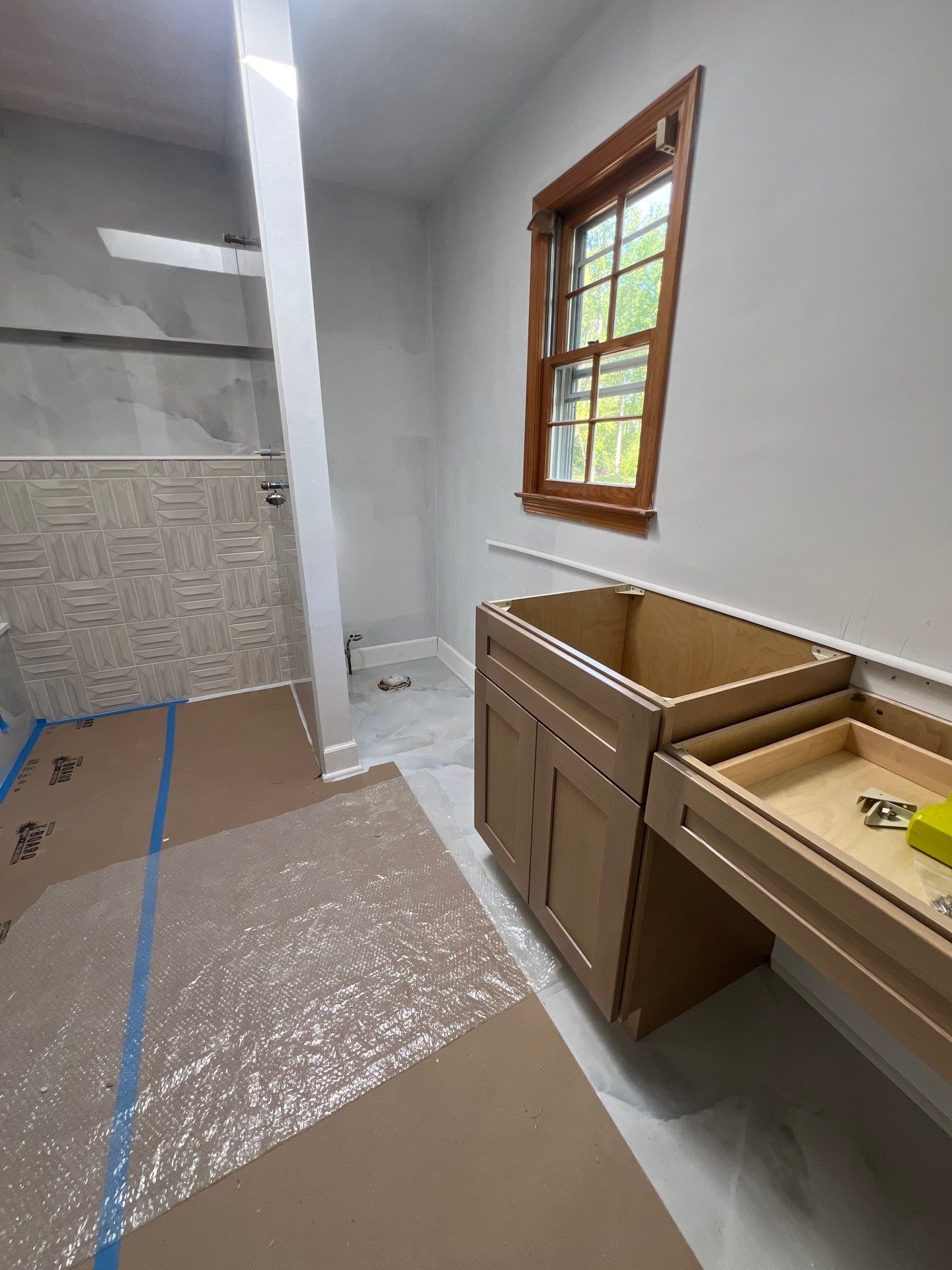 Modern Bathroom Remodeling Featuring Marble Tiles and Custom Cabinetry in Smyrna by Swift Home Renovations