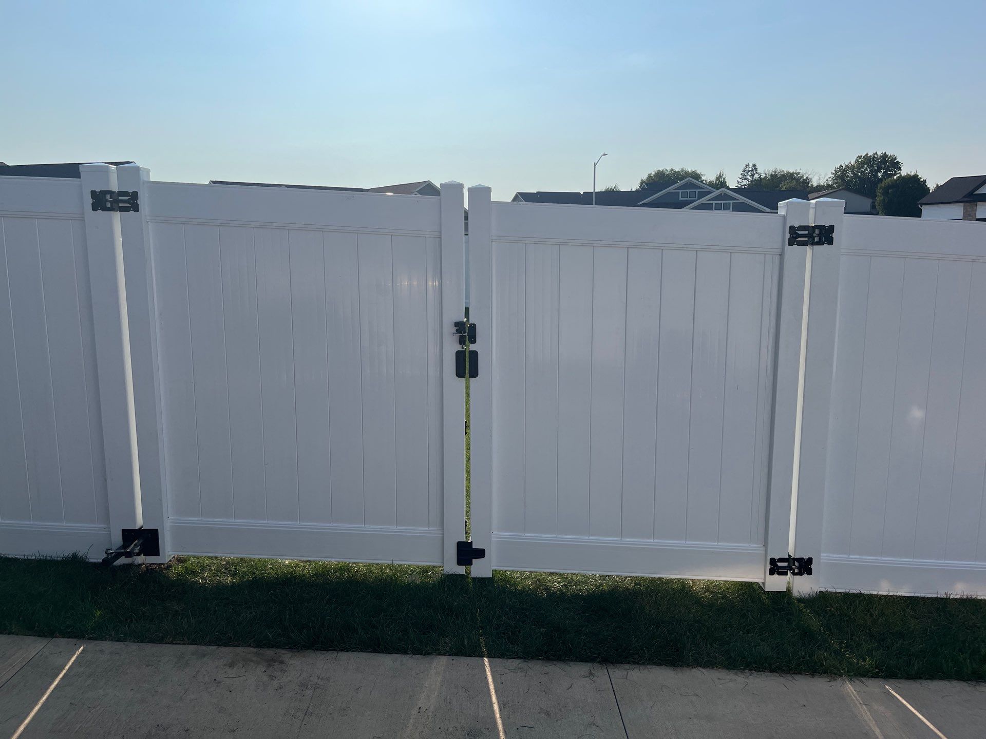 White Vinyl Privacy Fence Installation With Double Gates in Waterloo by Perfect Picket Fence and Stain