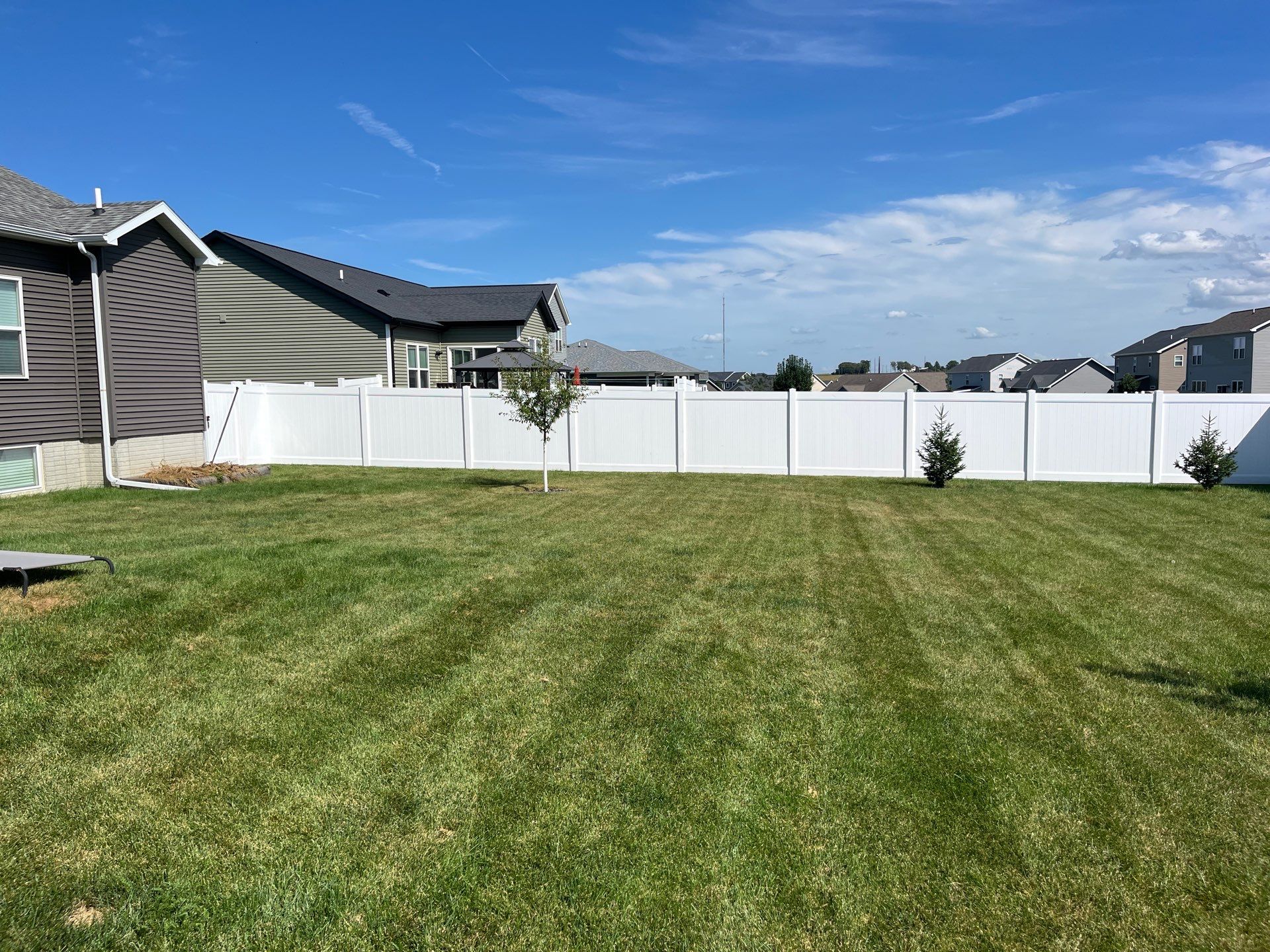 New Vinyl Privacy Fencing and Gates for Waterloo Residential Backyard by Perfect Picket Fence and Stain