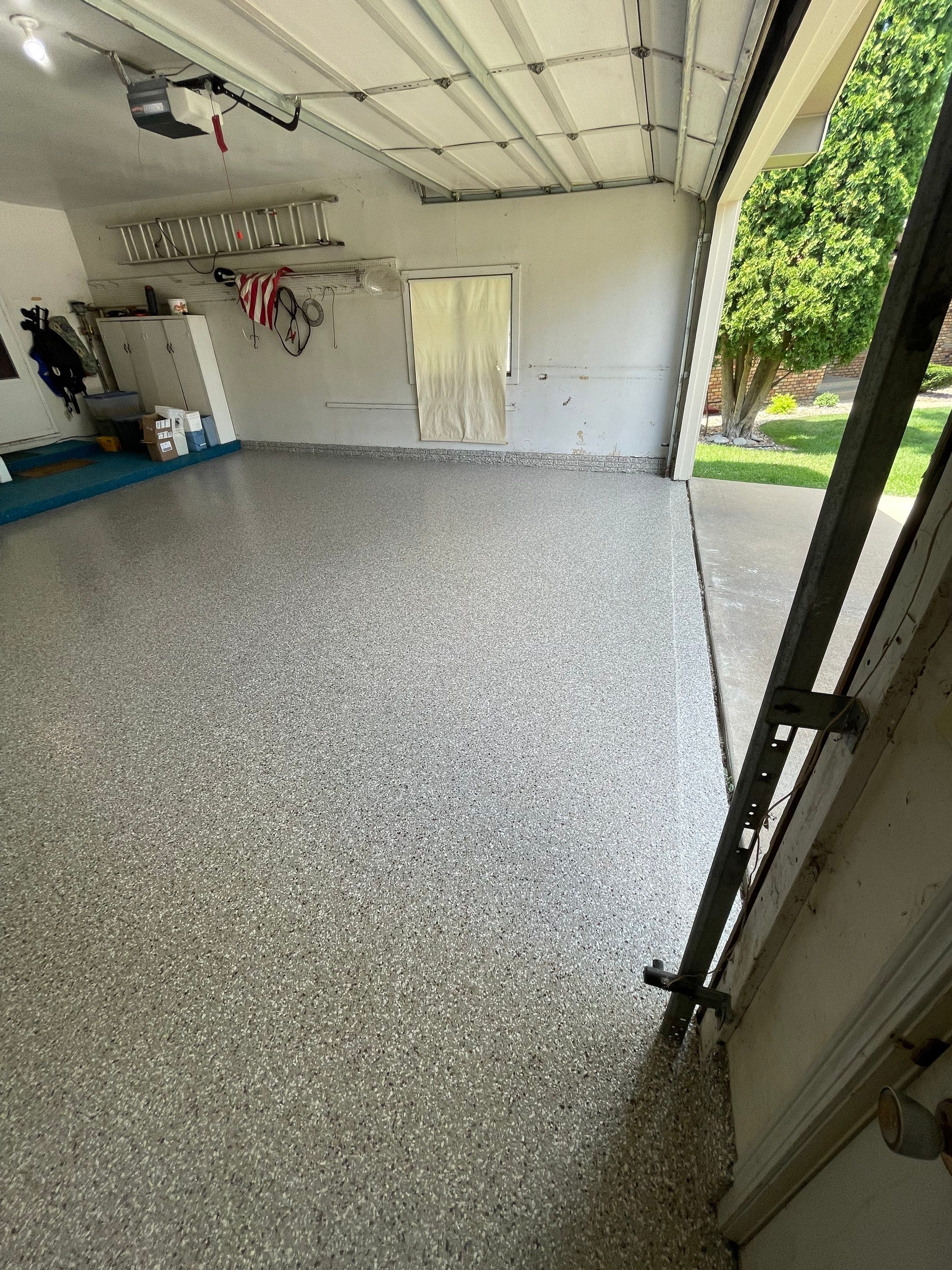 Custom Creekbed Garage Floor Coating in Sioux Falls by Select Painting, Coatings & Garage Cabinets