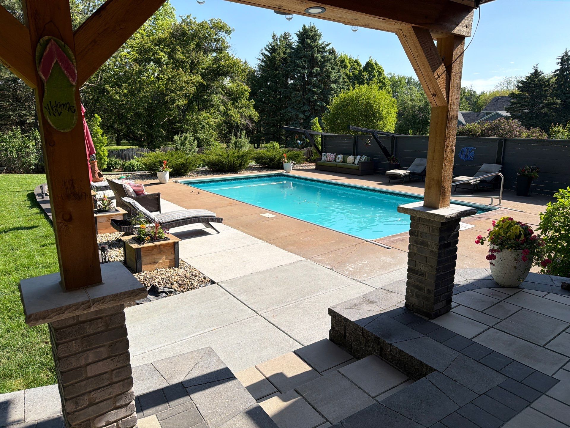 Garage Floor and Textured Pool Deck Coating in Sioux Falls by Select Painting, Coatings & Garage Cabinets