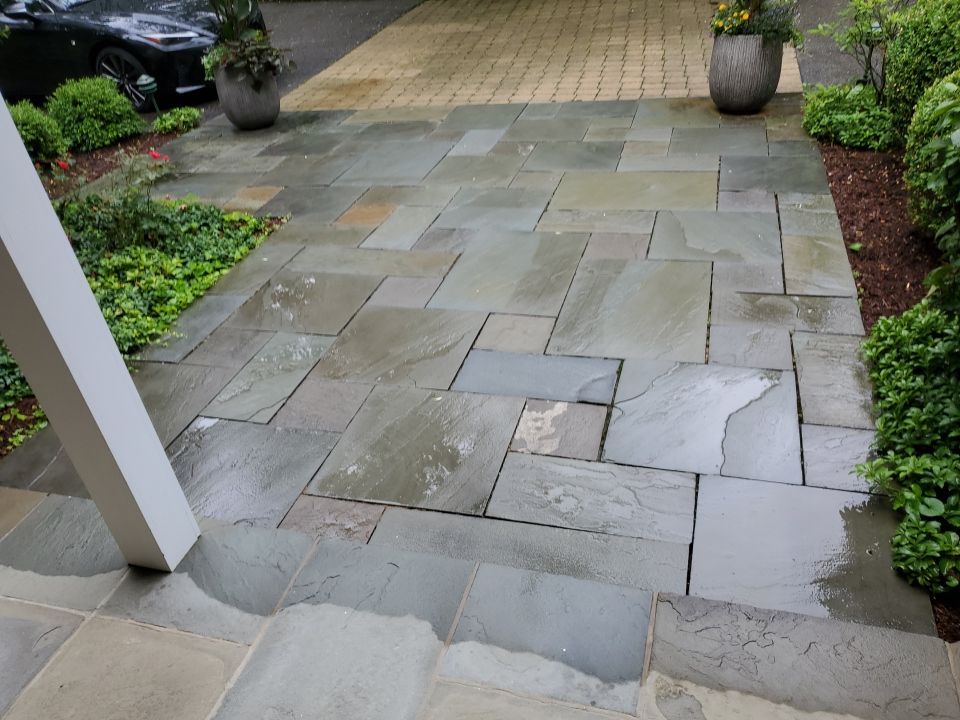 Bluestone patio cleaning by Northern Power Washing LLC.