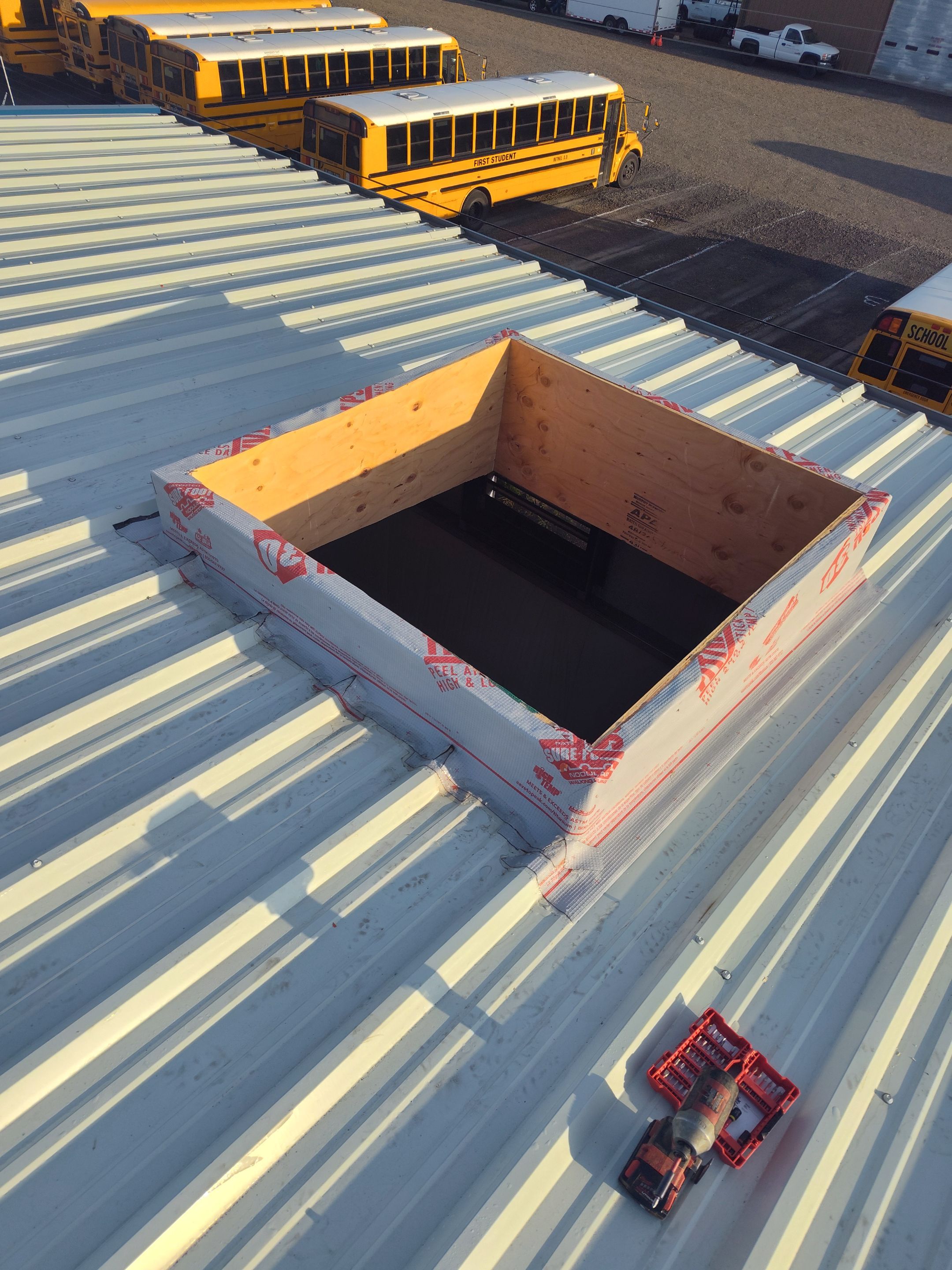 Installing New Curbs on a Metal Roof for new equipment by BEST Roofing & Waterproofing