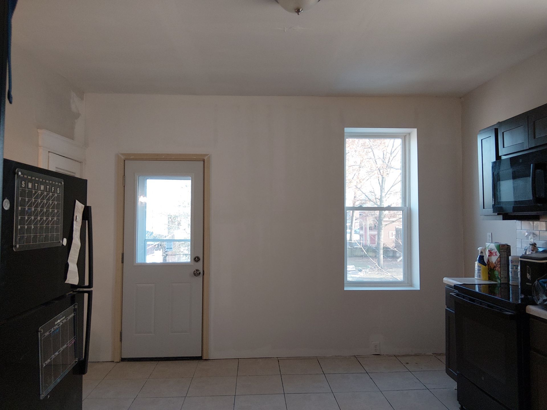 Rear Door Replacement and Kitchen Wall Restoration – St. Louis, MO by Legendary Services Company LLC.