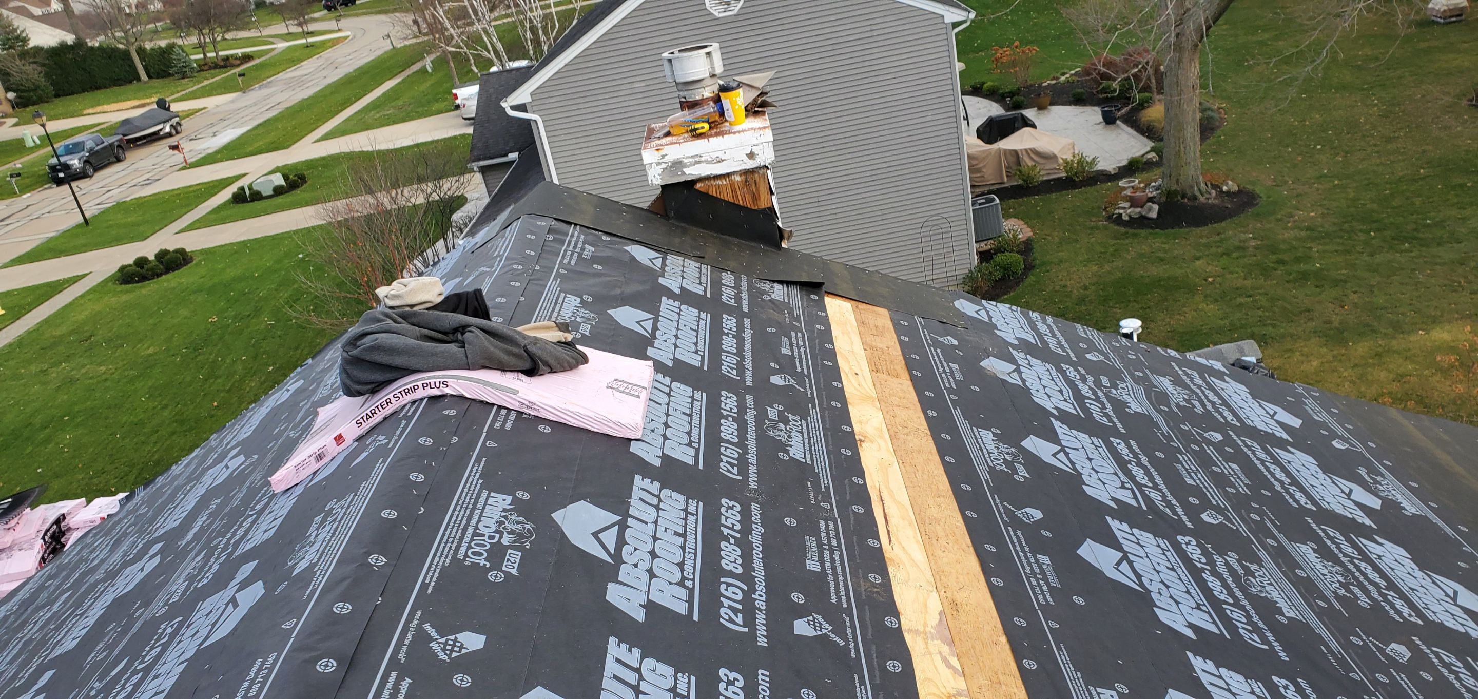 James Hardie Siding  using James Hardie Board and Batten, White by Absolute Roofing and Construction