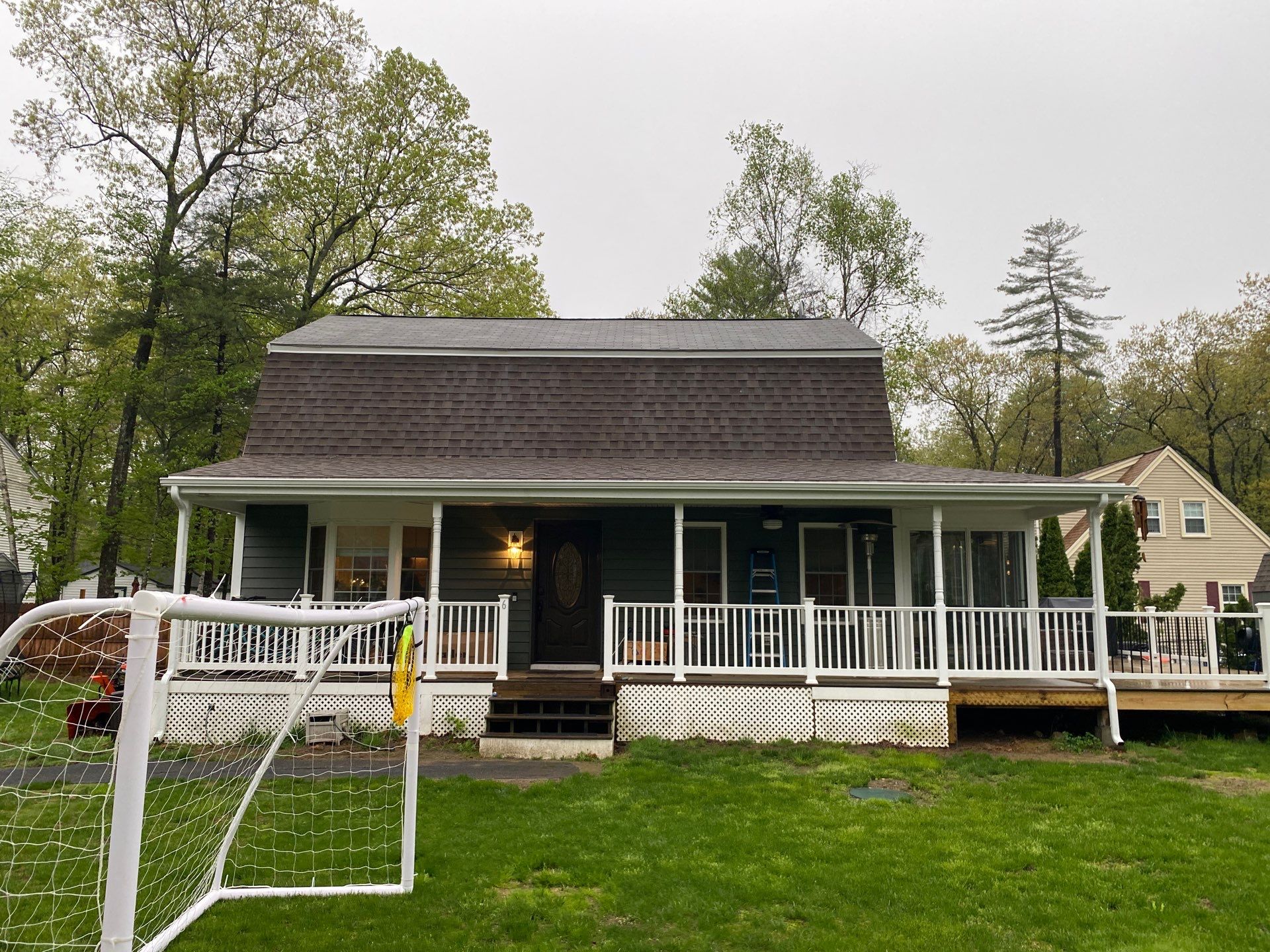 Full Roof Replacement & Farmers Porch Restoration – Asphalt + Standing Seam Metal by Mighty Dog Roofing of Greater Middlesex County