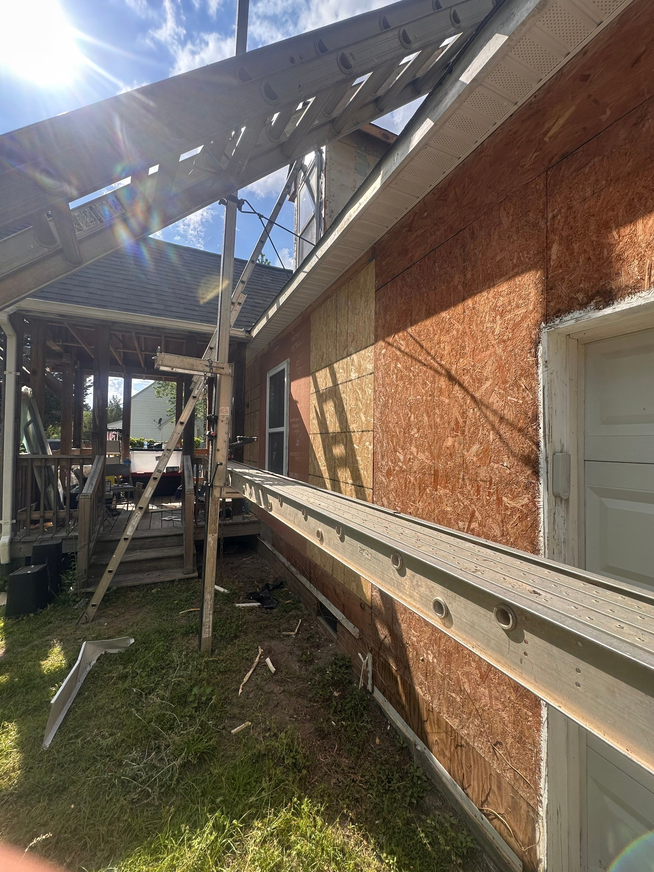 Gloucester Exterior Overhaul with Navy Blue Siding and New Roof by Cade Construction