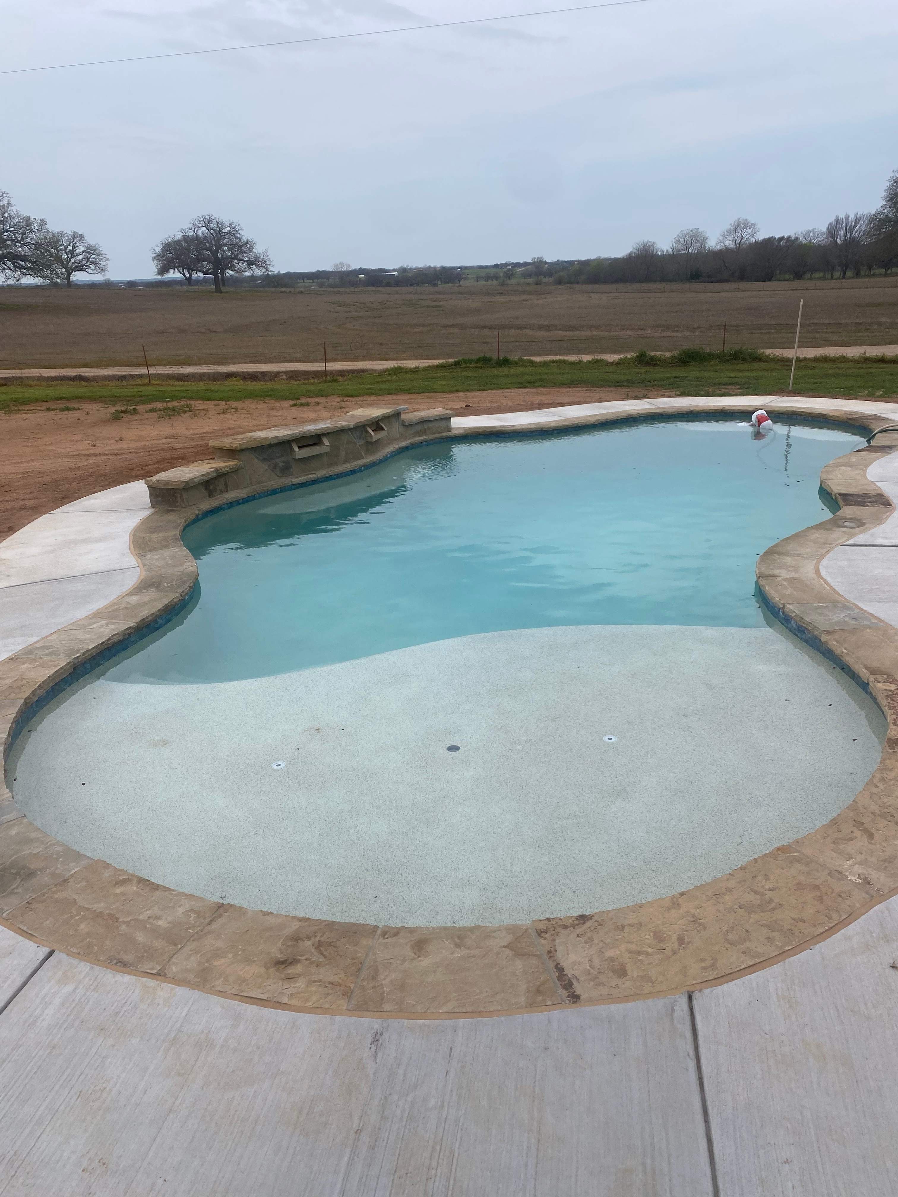 Freeform Pool with Raised Spa and Spillway by Pinnacle Pools and Spas - DFW