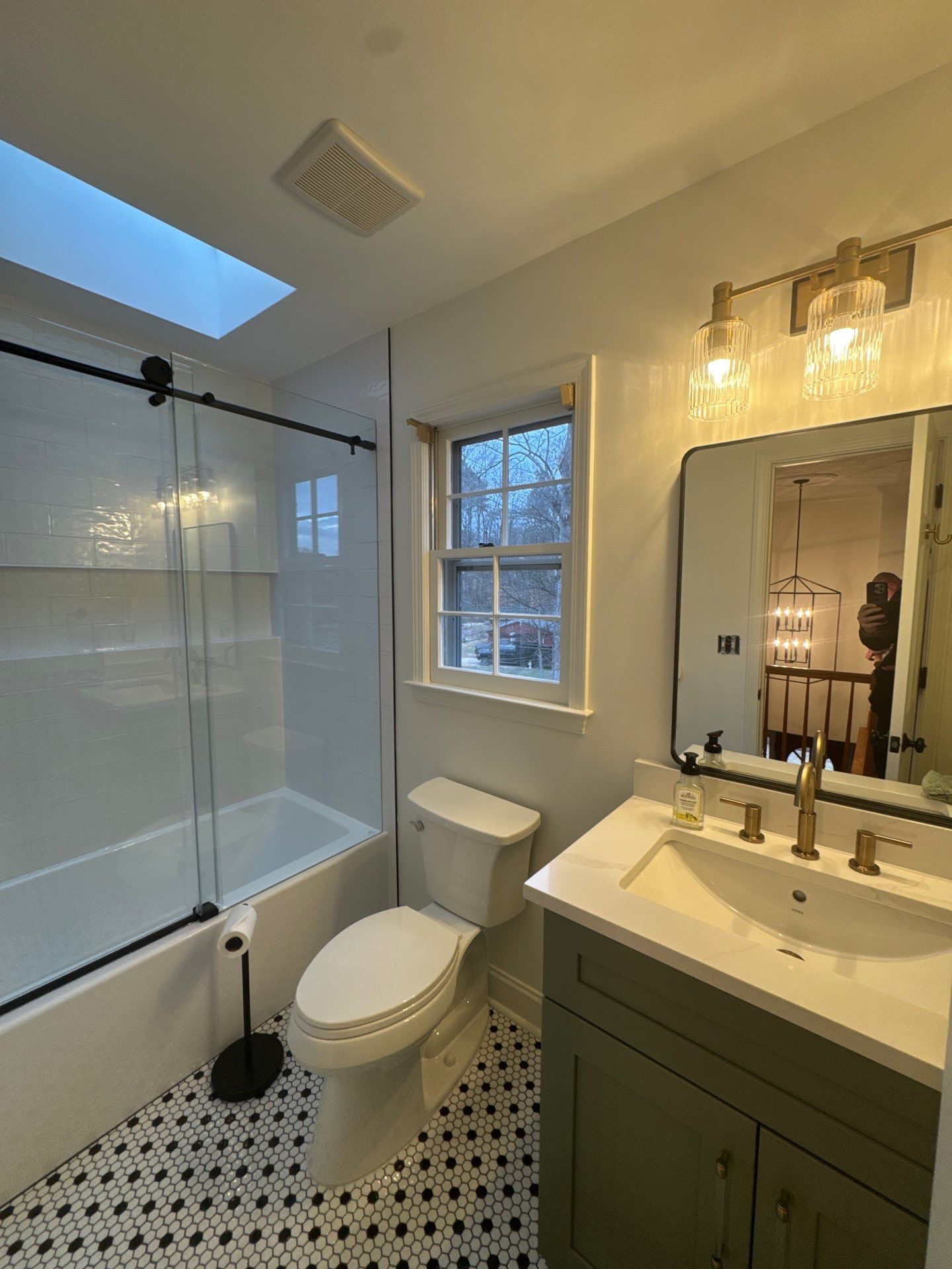 Smyrna Bathroom Remodel Featuring Sage Green Vanity and Hexagonal Tile by Swift Home Renovations