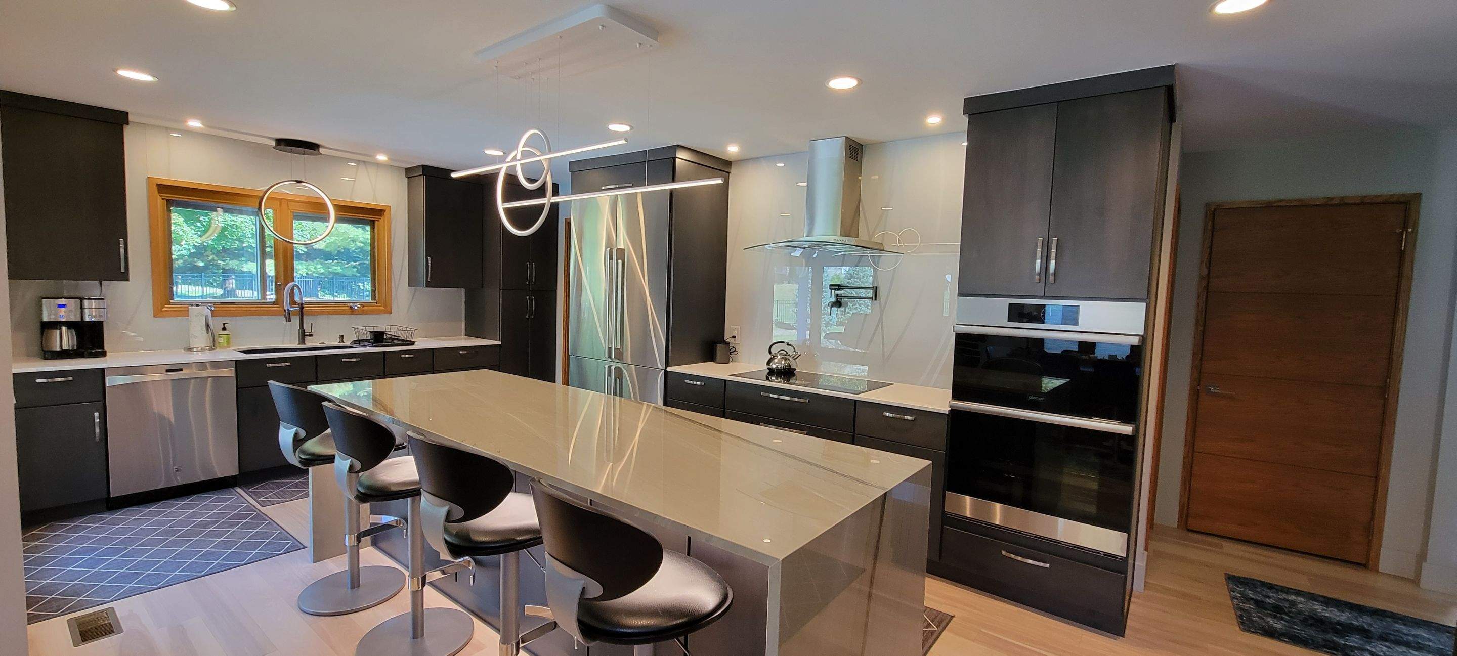 Kitchen Remodel using IMAGIO Misty Curves Solid Glass Backsplash by IMAGIO