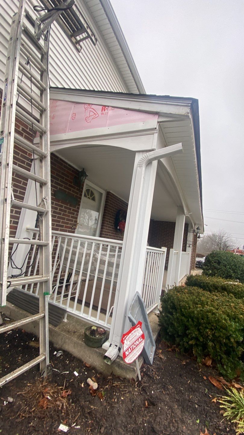 Replace dated vinyl siding with new white exterior Portfolio vinyl siding  by Secure Construction Company Inc