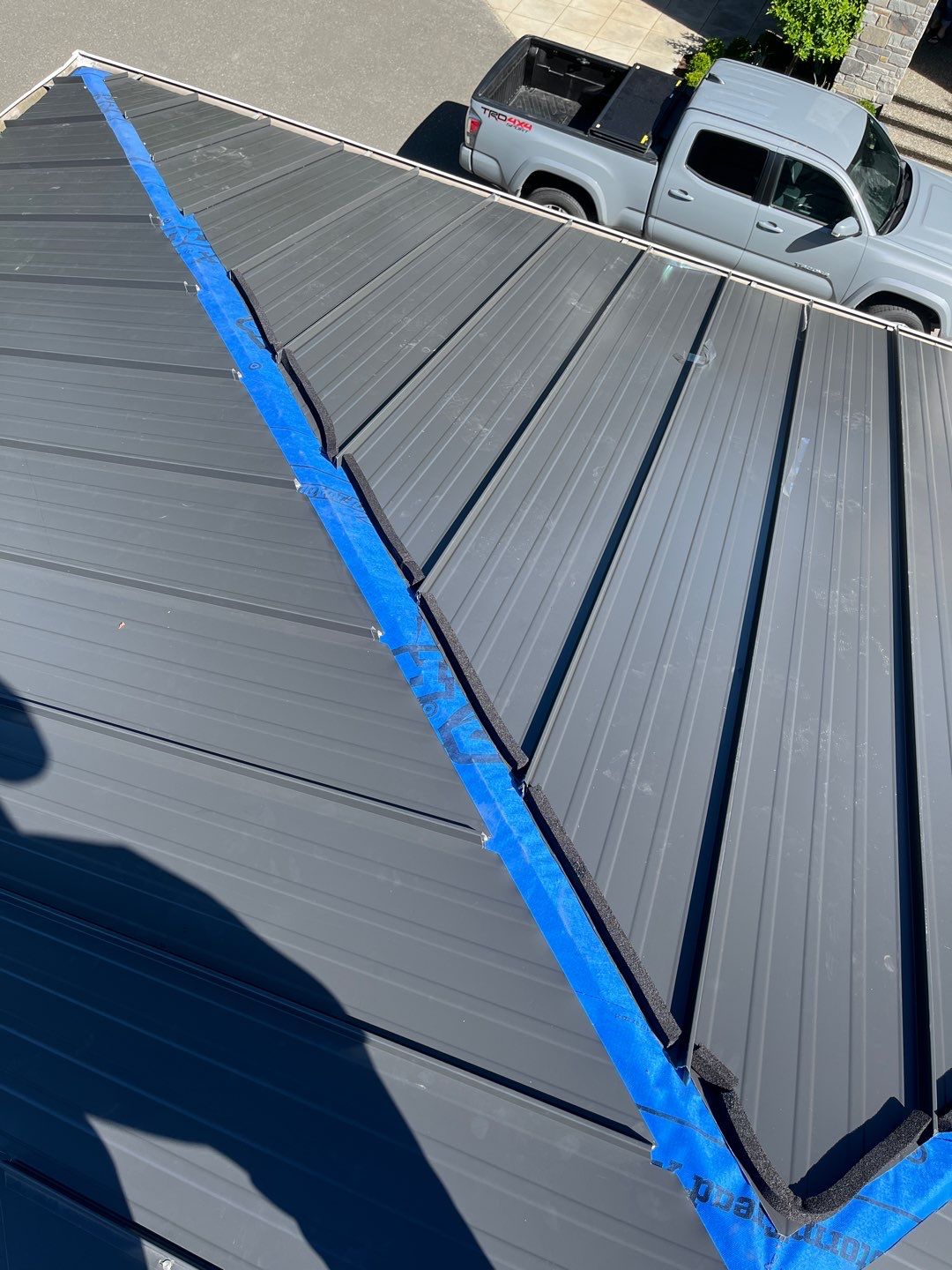 Residential Roofing Installation using 12" Prolok metal  by Top Notch Roofing Inc