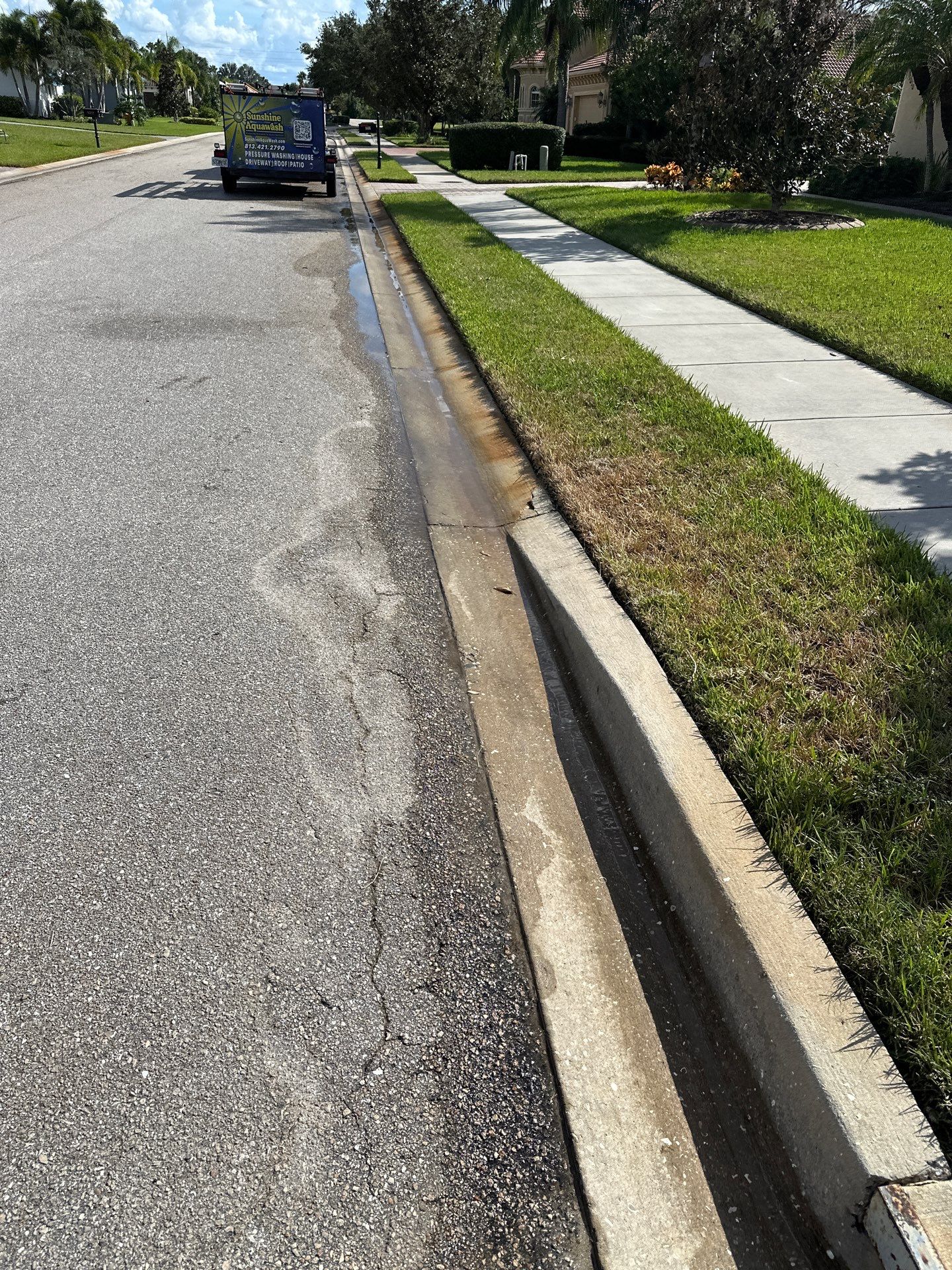Paver Driveway, Entryway, Sidewalk, and Street Curbing Cleaning in Winding River Community, Bradenton, FL by Sunshine AquaWash