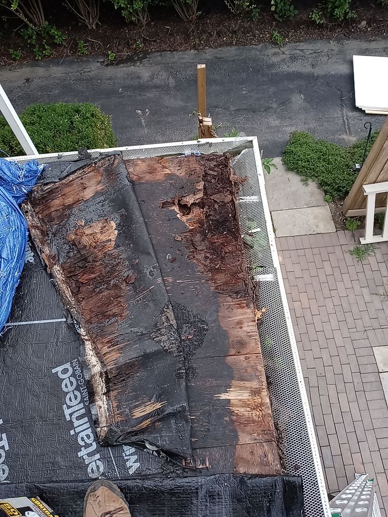 Residential Roofing Installation, Dec-tek walk-out porch roof, siding on garage by Absolute Roofing and Construction