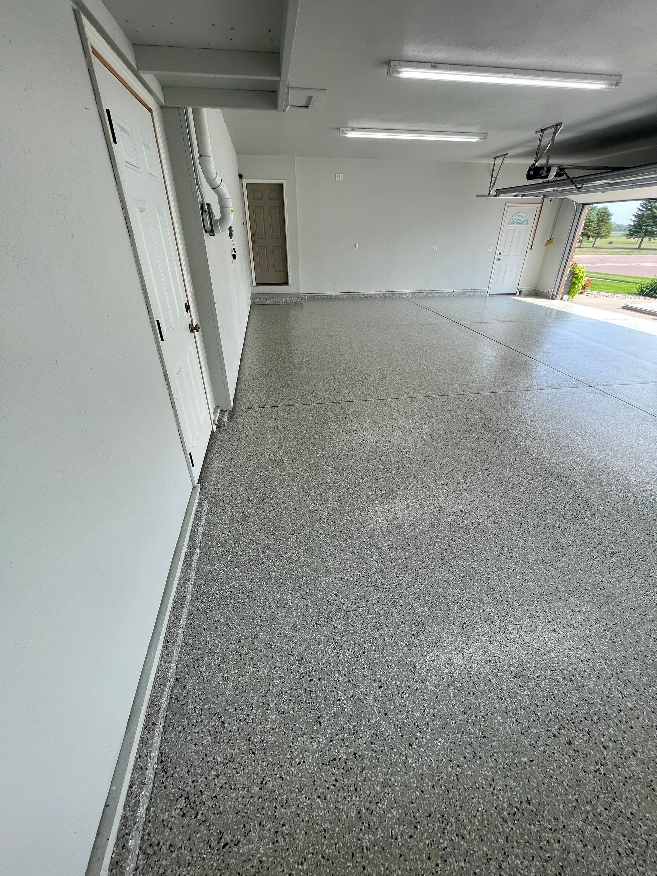 Multi-Car Garage Floor Coating and Crack Repair in Tea by Select Painting, Coatings & Garage Cabinets