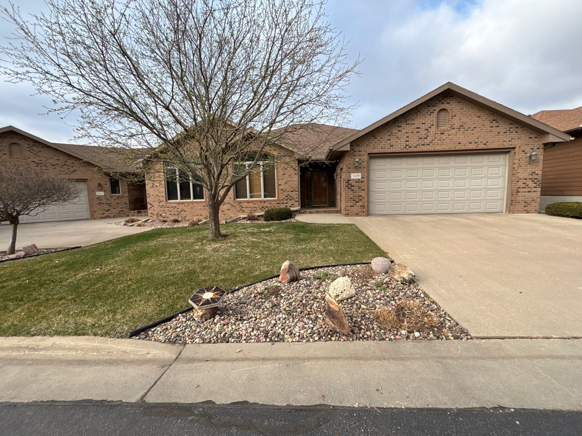 Multi-Story Residential Exterior Painting and Siding Refresh in Sioux Falls by Select Painting, Coatings & Garage Cabinets