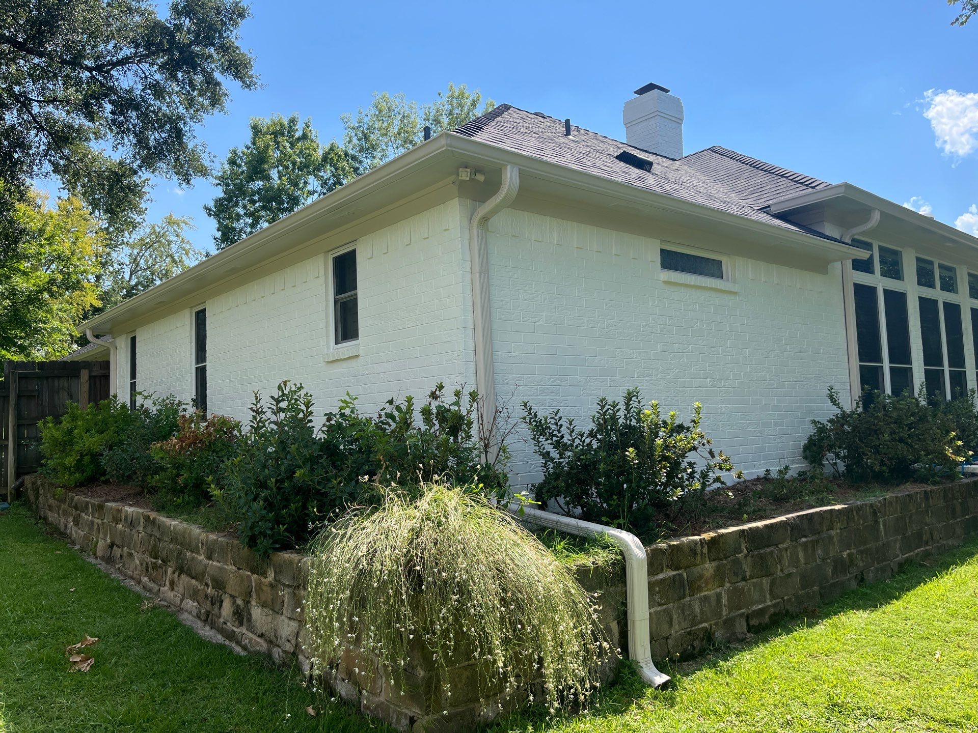 Exterior Painting in Tyler, TX | Brick House with White & Blue Finish by Quality Coats Painting