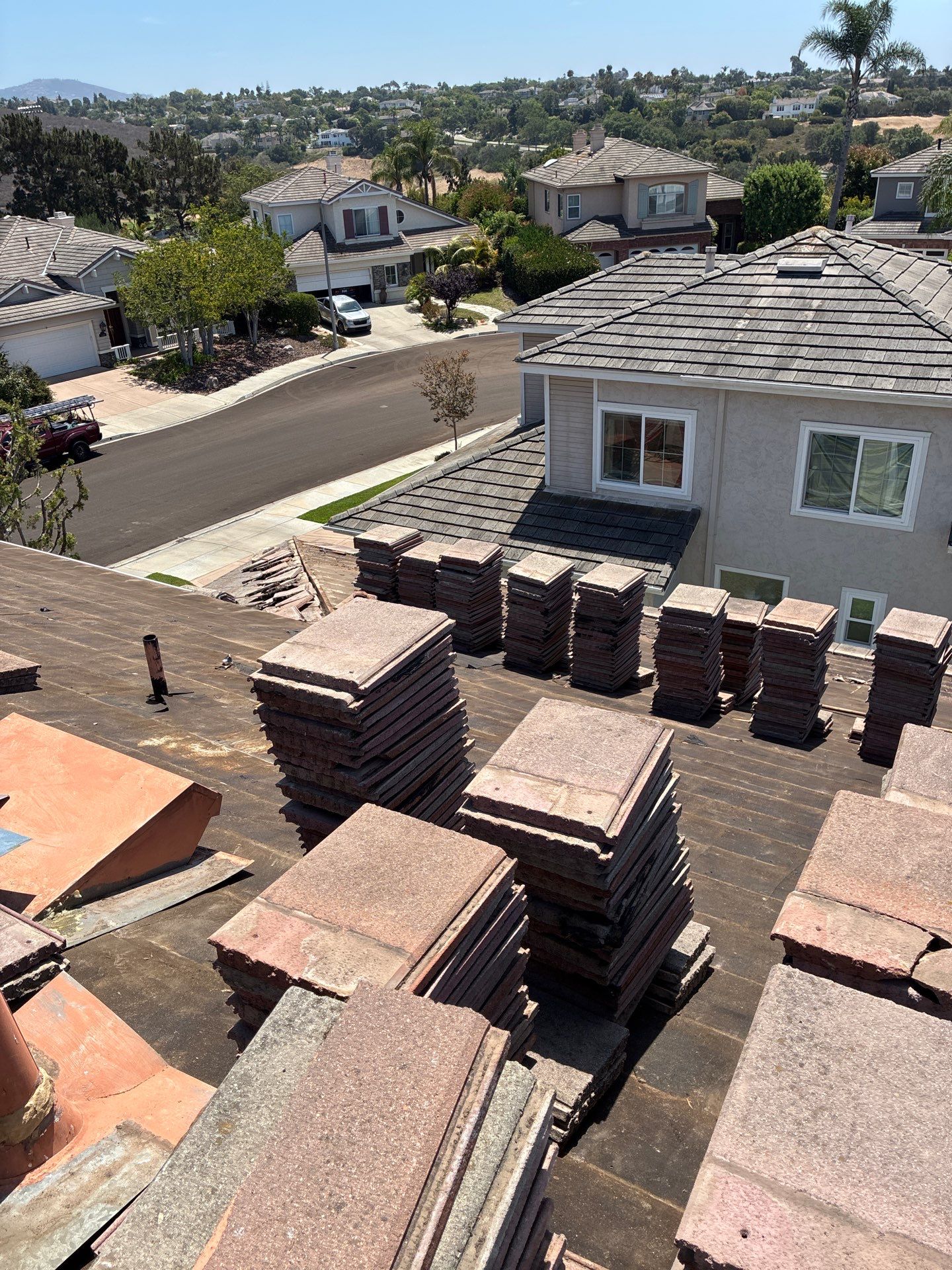 Carlsbad Concrete Tile Roof Replacement with Copper Flashing and Skylights by Reliable Roofing San Diego Inc.